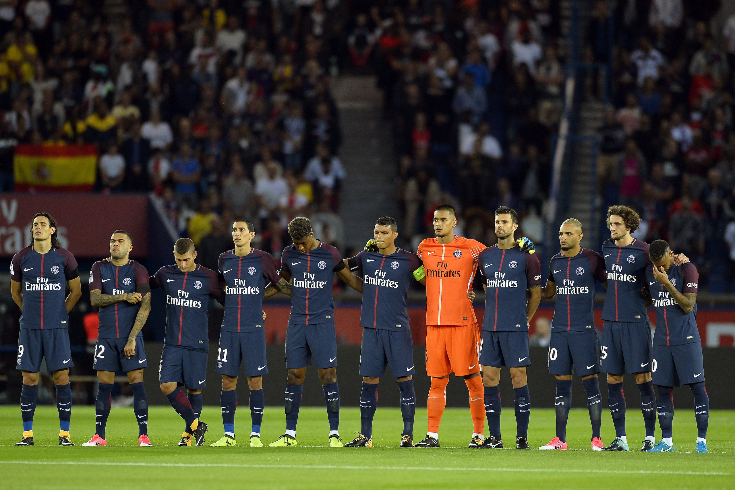 PARIS, FRANCE - AUGUST 20:  (L-R) Edinson Cavani, Dani Alves, Marco Verratti, Angle Di Maria, Presnel Kimpembe, Thiago Silva, Alphonse Areola, Thiago Motta, Layvin Kurzawa, Adrien Rabiot, Neymar Jr of Paris Saint-Germain pay tribute to the victims of the 