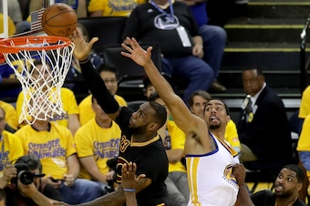 OAKLAND, CA - JUNE 13:  LeBron James #23 of the Cleveland Cavaliers goes up for a shot in front of James Michael McAdoo #20 of the Golden State Warriors in the first half in Game 5 of the 2016 NBA Finals at ORACLE Arena on June 13, 2016 in Oakland, Califo