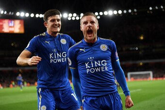 LONDON, ENGLAND - AUGUST 11:  Jamie Vardy (R) of Leicester City is congratulated by teammate Harry Maguire (L) after scoring his team's third goal during the Premier League match between Arsenal and Leicester City at the Emirates Stadium on August 11, 201