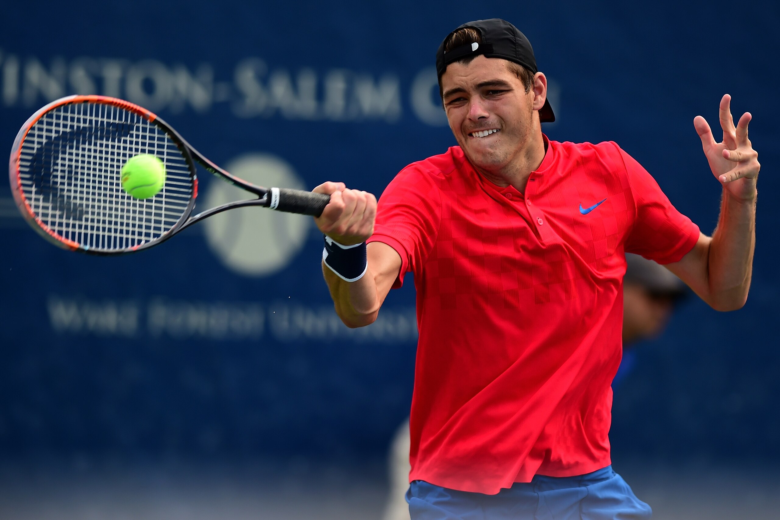WINSTON-SALEM, NC - AUGUST 23:  Taylor Fritz returns a shot to Paolo Lorenzi of Italy during the fifth day of the Winston-Salem Open at Wake Forest University on August 23, 2017 in Winston-Salem, North Carolina.  (Photo by Jared C. Tilton/Getty Images)