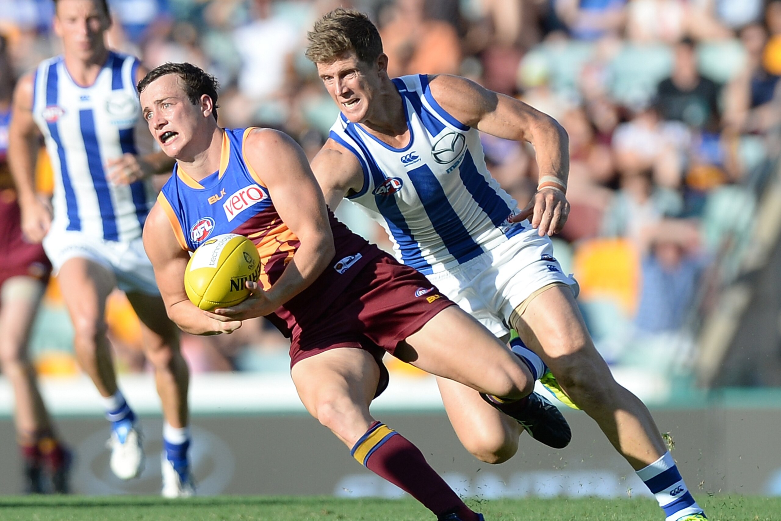 BRISBANE, QUEENSLAND - APRIL 02: Lewis Taylor of the Lions attempts to break away from the defence during the round two AFL match between the Brisbane Lions and the North Melbourne Kangaroos at The Gabba on April 2, 2016 in Brisbane, Australia. (Photo b BRISBANE, QUEENSLAND - APRIL 02: Lewis Taylor of the Lions attempts to break away from the defence during the round two AFL match between the Brisbane Lions and the North Melbourne Kangaroos at The Gabba on April 2, 2016 in Brisbane, Australia. (Photo b
