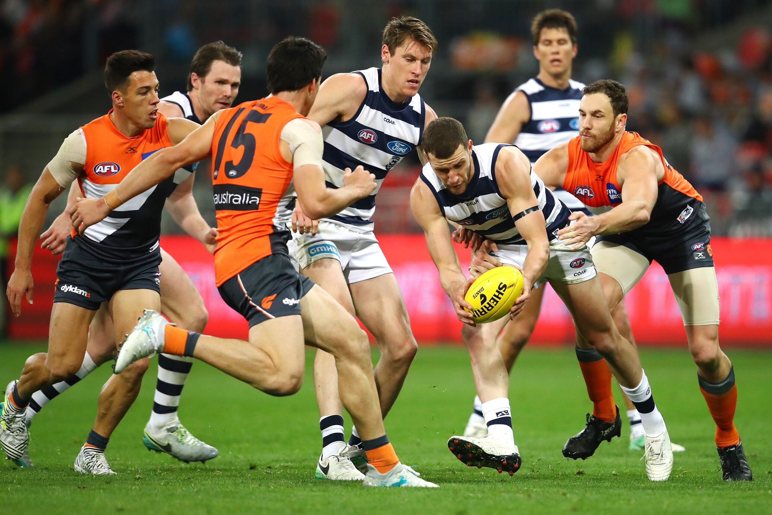 SYDNEY, AUSTRALIA - JULY 01: Sam Menegola of the Cats is tackled during the round 15 AFL match between the Greater Western Sydney Giants and the Geelong Cats at Spotless Stadium on July 1, 2017 in Sydney, Australia. (Photo by Cameron Spencer/AFL Media/Ge SYDNEY, AUSTRALIA - JULY 01: Sam Menegola of the Cats is tackled during the round 15 AFL match between the Greater Western Sydney Giants and the Geelong Cats at Spotless Stadium on July 1, 2017 in Sydney, Australia. (Photo by Cameron Spencer/AFL Media/Ge