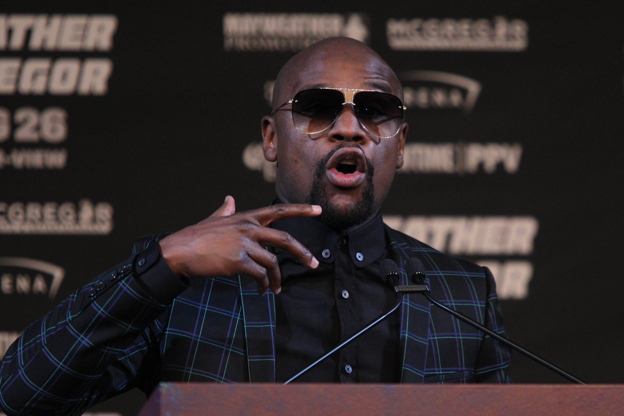 Boxer Floyd Mayweather Jr. speaks during a press conference with MMA fighter Connor Mcgregor (out of frame) August 23, 2017 at the MGM Grand in Las Vegas, Nevada. 
Mayweather, the 40-year-old undefeated former welterweight boxing champion, has been lured 