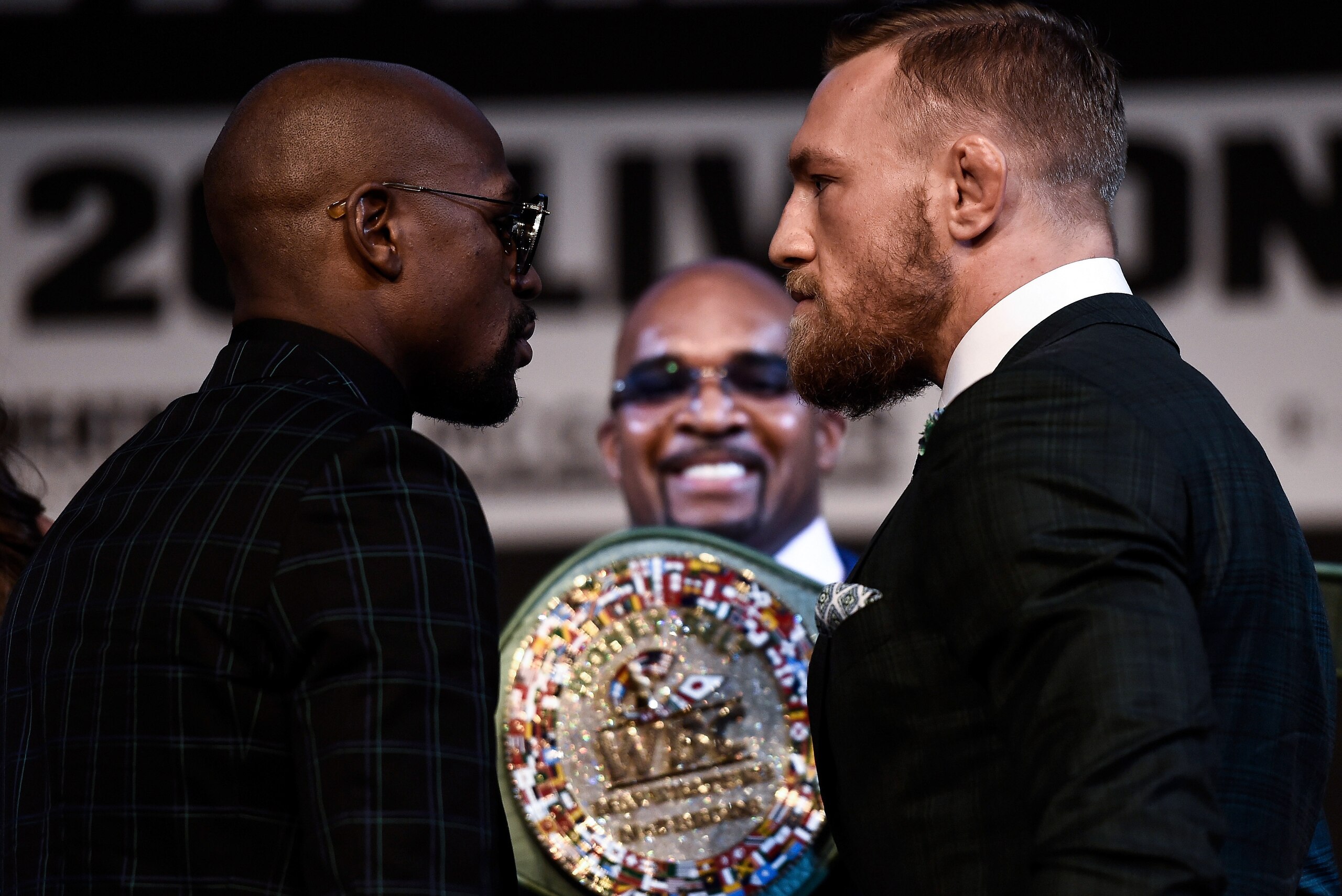 LAS VEGAS, NV - AUGUST 23:  (L-R) Boxer Floyd Mayweather Jr. and UFC lightweight champion Conor McGregor face off during a news conference at the KA Theatre at MGM Grand Hotel & Casino on August 23, 2017 in Las Vegas, Nevada. The two will meet in a super 