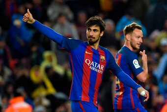 Barcelona's Portuguese midfielder Andre Gomes (L) celebrates after scoring a goal during the Spanish league football match FC Barcelona vs CA Osasuna at the Camp Nou stadium in Barcelona on April 26, 2017. / AFP PHOTO / LLUIS GENE        (Photo credit sho