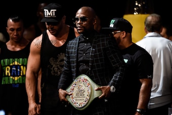 Mayweather with the non-title title belt at his final press conference Wednesday, where he read a prepared statement instead of reacting to McGregor's off-the-cuff remarks.