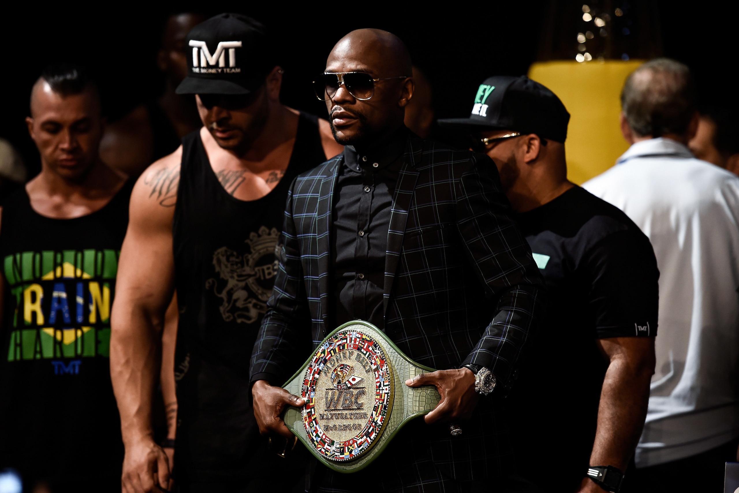Mayweather with the non-title title belt at his final press conference Wednesday, where he read a prepared statement instead of reacting to McGregor's off-the-cuff remarks.
