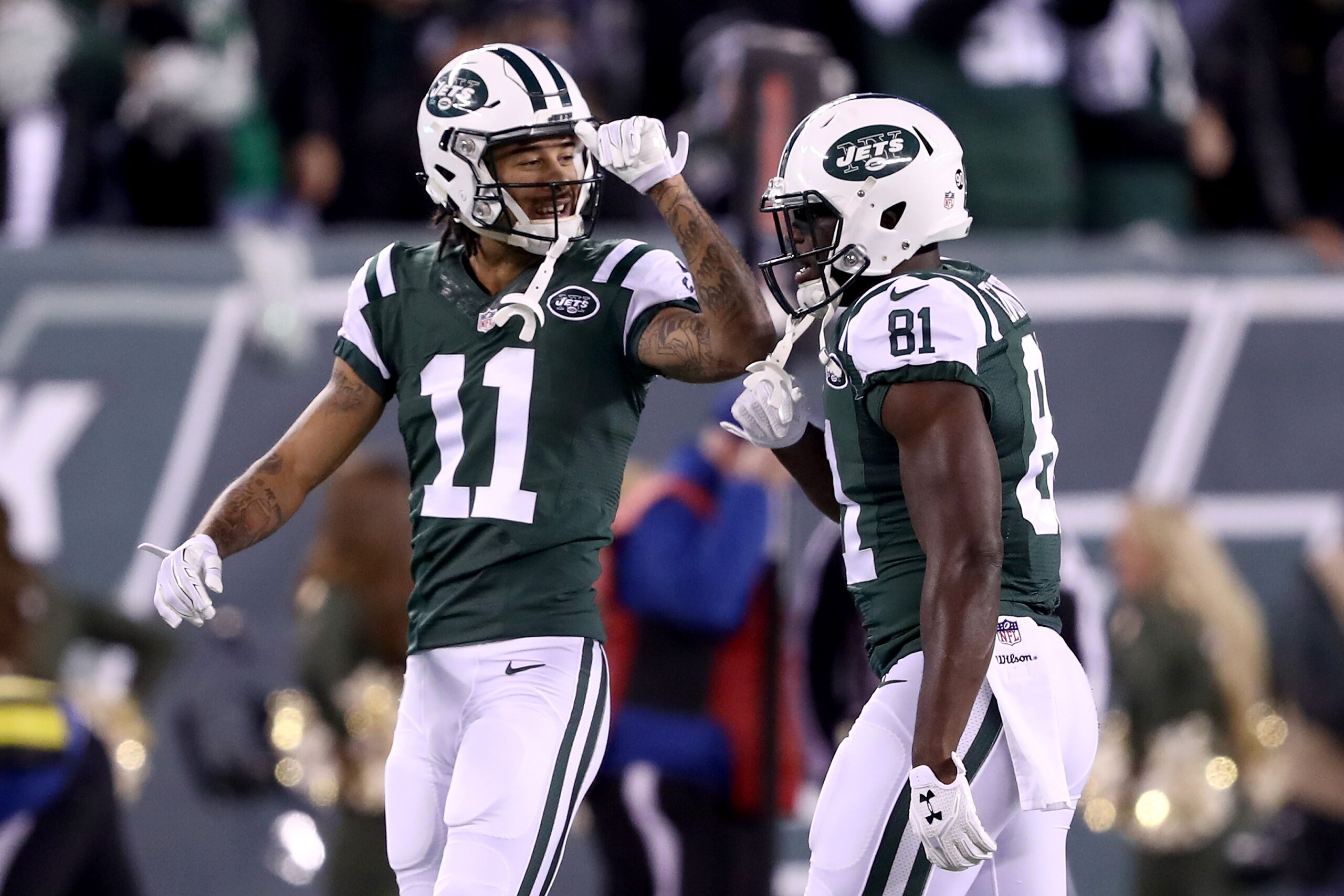 EAST RUTHERFORD, NJ - NOVEMBER 27:  Quincy Enunwa #81 of the New York Jets celebrates with  Robby Anderson #11 after scoring a 22 yard touchdown pass against the New England Patriots during the fourth quarter in the game at MetLife Stadium on November 27,