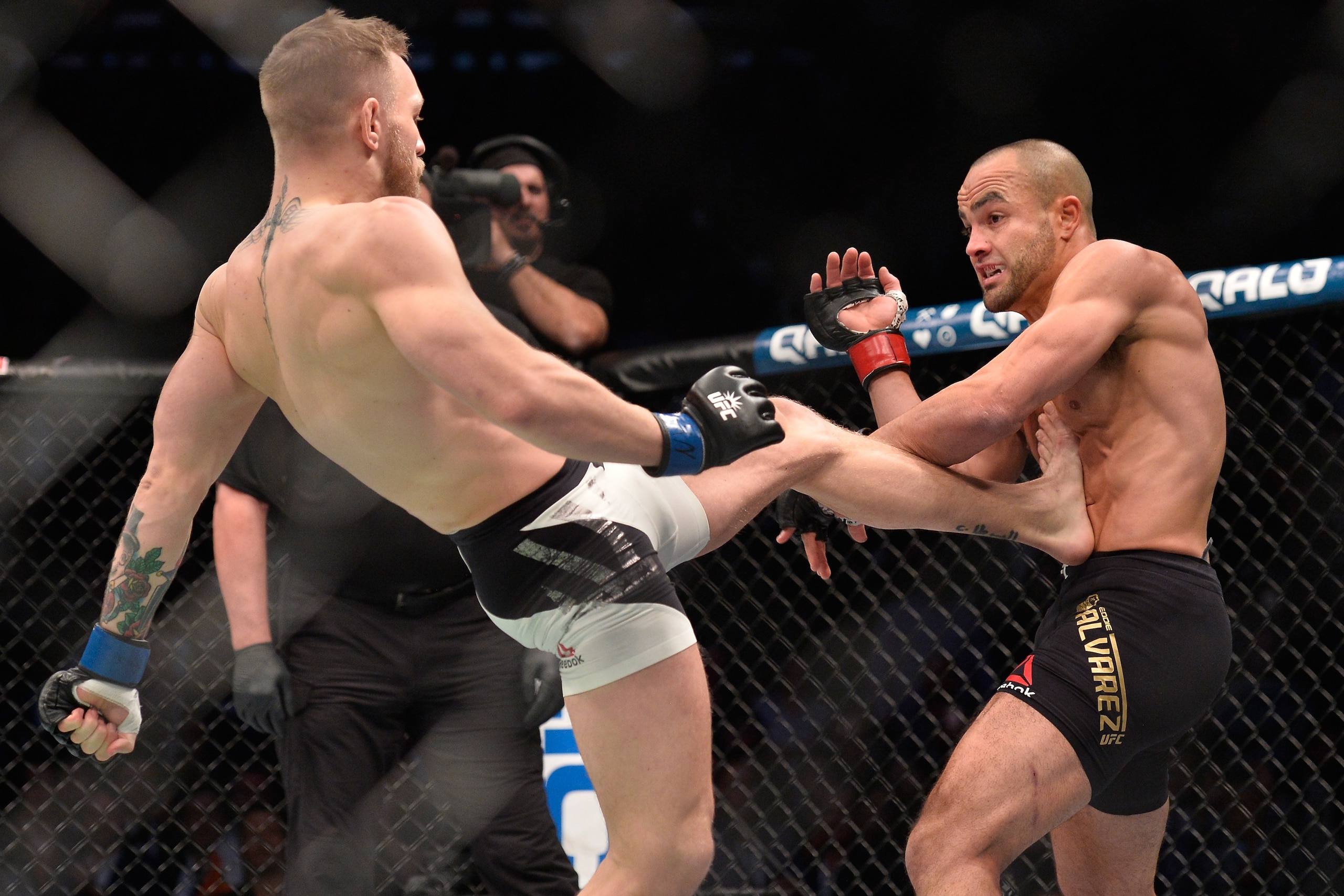 NEW YORK, NY - NOVEMBER 12:  (L-R) Conor McGregor of Ireland kicks Eddie Alvarez in their UFC lightweight championship fight during the UFC 205 event at Madison Square Garden on November 12, 2016 in New York City. (Photo by Brandon Magnus/Zuffa LLC/Zuffa 