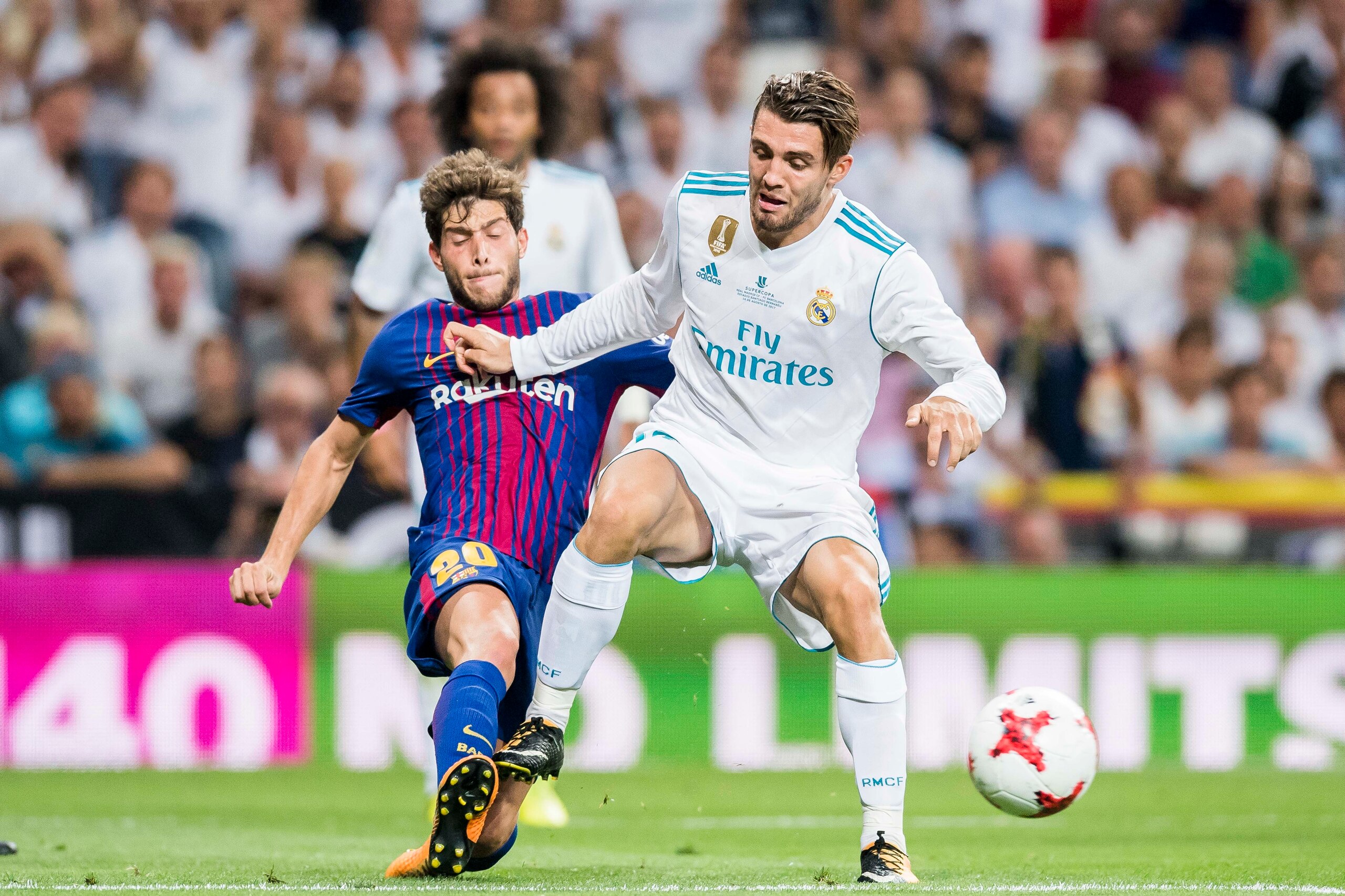 MADRID, SPAIN - AUGUST 16 - Mateo Kovacic (r) of Real Madrid battles for the ball with Sergi Roberto Carnicer of FC Barcelona during their Supercopa de Espana Final 2nd Leg match between Real Madrid and FC Barcelona at the Estadio Santiago Bernabeu on 16 MADRID, SPAIN - AUGUST 16 - Mateo Kovacic (r) of Real Madrid battles for the ball with Sergi Roberto Carnicer of FC Barcelona during their Supercopa de Espana Final 2nd Leg match between Real Madrid and FC Barcelona at the Estadio Santiago Bernabeu on 16