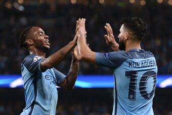Manchester City's Argentinian striker Sergio Aguero (R) is congratulated by Manchester City's English midfielder Raheem Sterling (L) after scoring their third goal and completing his hattrick during the UEFA Champions League group C football match between
