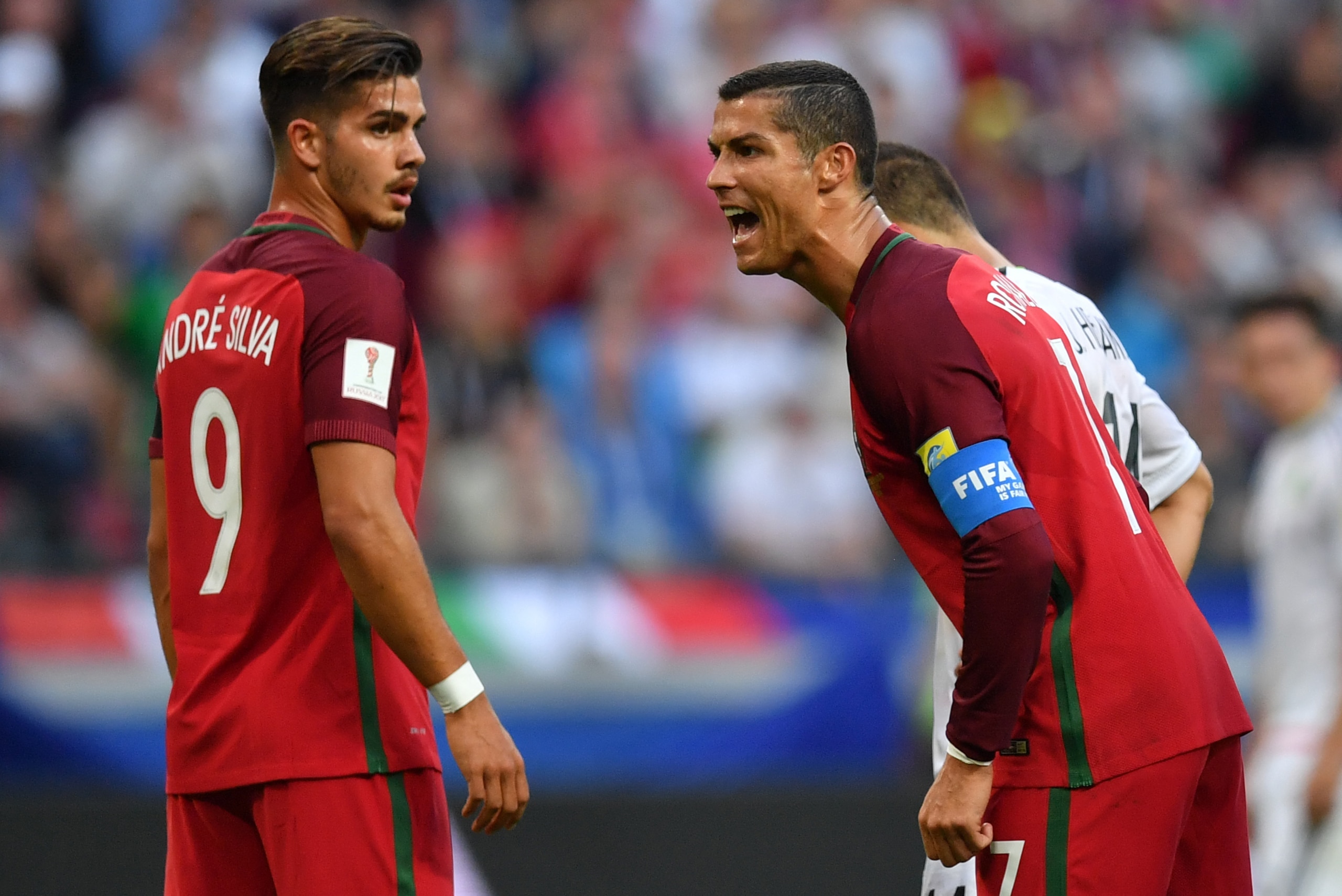 TOPSHOT - Portugal's forward Cristiano Ronaldo (R) reacts next to Portugal's forward Andre Silva during the 2017 Confederations Cup group A football match between Portugal and Mexico at the Kazan Arena in Kazan on June 18, 2017. / AFP PHOTO / Yuri CORTEZ 