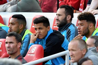 LIVERPOOL, ENGLAND - AUGUST 27: Alexis Sanchez of Arsenal looks on from the bench during the Premier League match between Liverpool and Arsenal at Anfield on August 27, 2017 in Liverpool, England.  (Photo by Michael Regan/Getty Images)