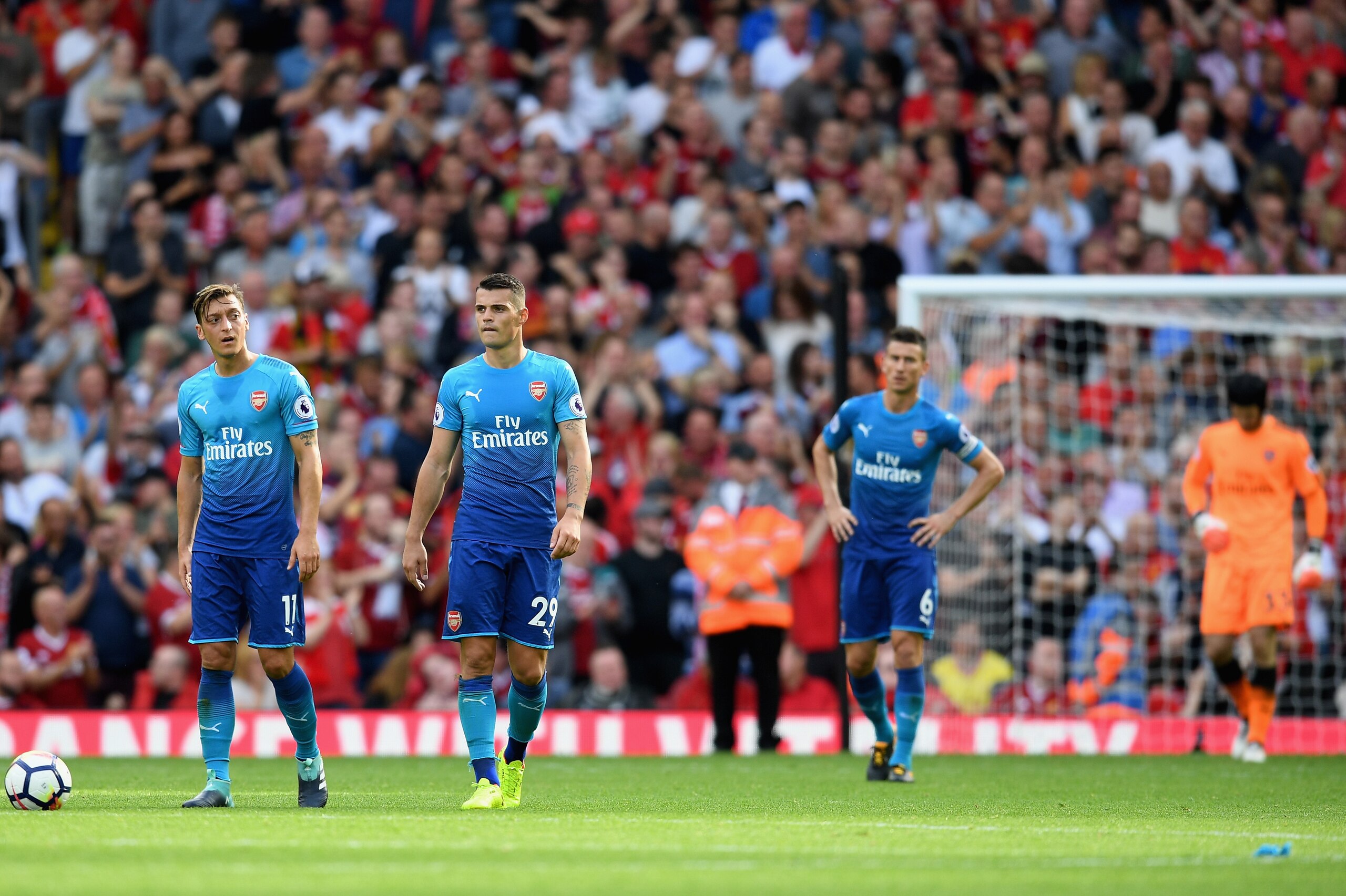 LIVERPOOL, ENGLAND - AUGUST 27:  Mesut Ozil of Arsenal are Granit Xhaka of Arsenal are dejected after Liverpool's fourth goal during the Premier League match between Liverpool and Arsenal at Anfield on August 27, 2017 in Liverpool, England.  (Photo by Mic