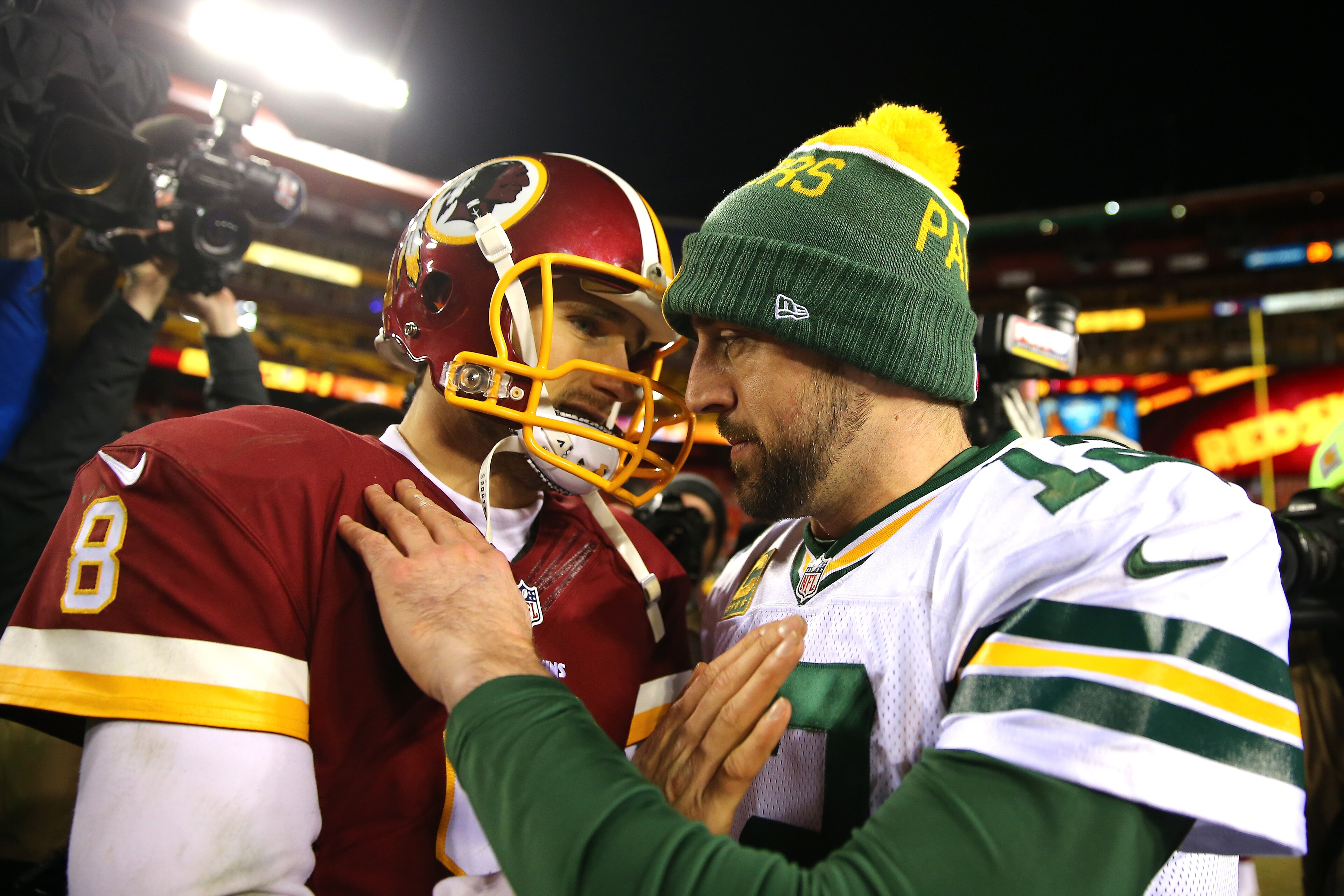 LANDOVER, MD - JANUARY 10: Quarterback Kirk Cousins #8 of the Washington Redskins greets quarterback Aaron Rodgers #12 of the Green Bay Packers after the Green Bay Packers defeated the Washington Redskins 35-18 during the NFC Wild Card Playoff game at Fed