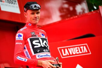 Sky's British cyclist Christopher Froome celebrates wearing the leader's red jersey on the podium after winning the 10th stage of the 72nd edition of 'La Vuelta' Tour of Spain cycling race, a 164,8 km route between Caravaca to Alhama de Murcia, on August 