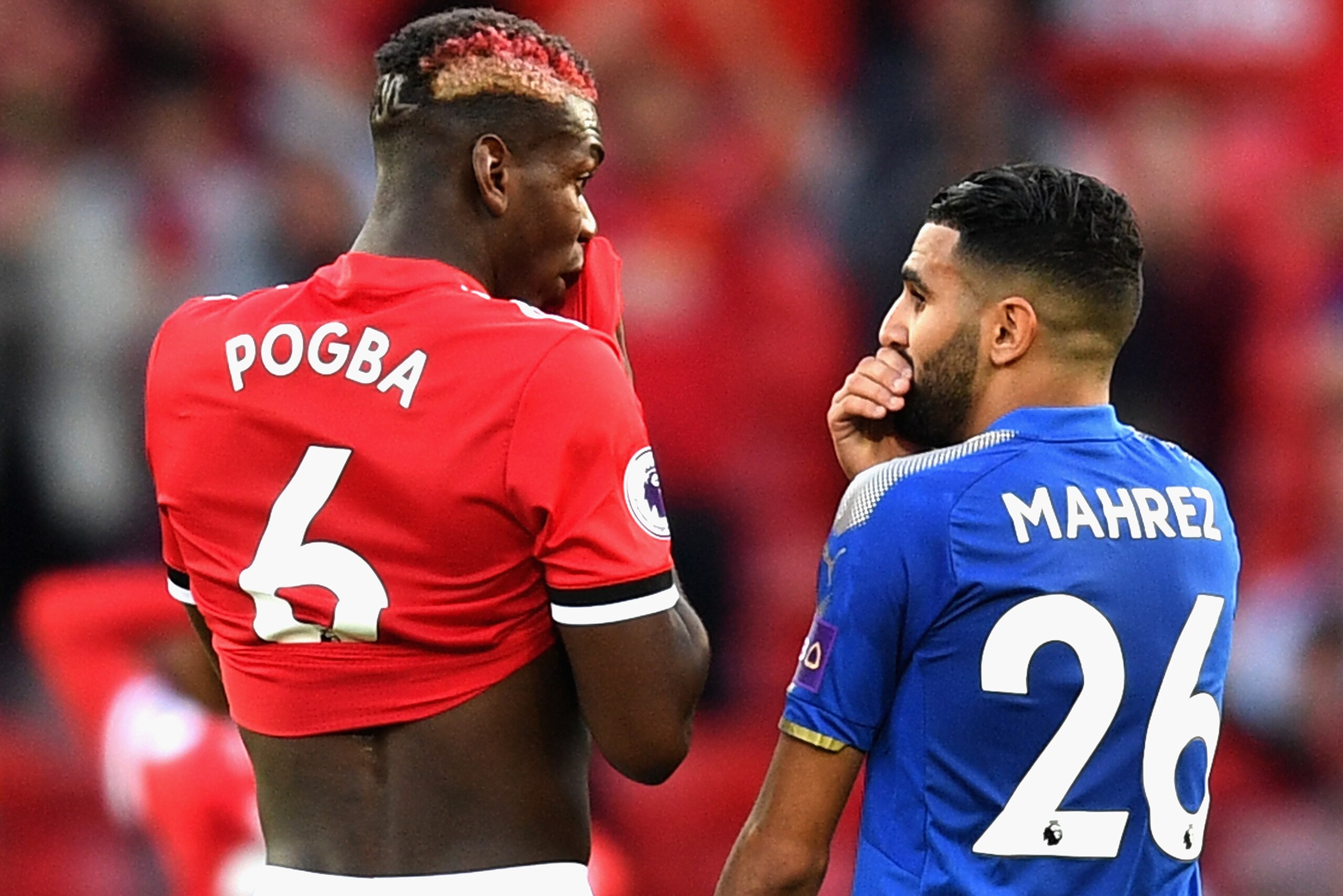 MANCHESTER, ENGLAND - AUGUST 26:  Riyad Mahrez of Leicester City speaks with Paul Pogba of Manchester United following the Premier League match between Manchester United and Leicester City at Old Trafford on August 26, 2017 in Manchester, England.  (Photo