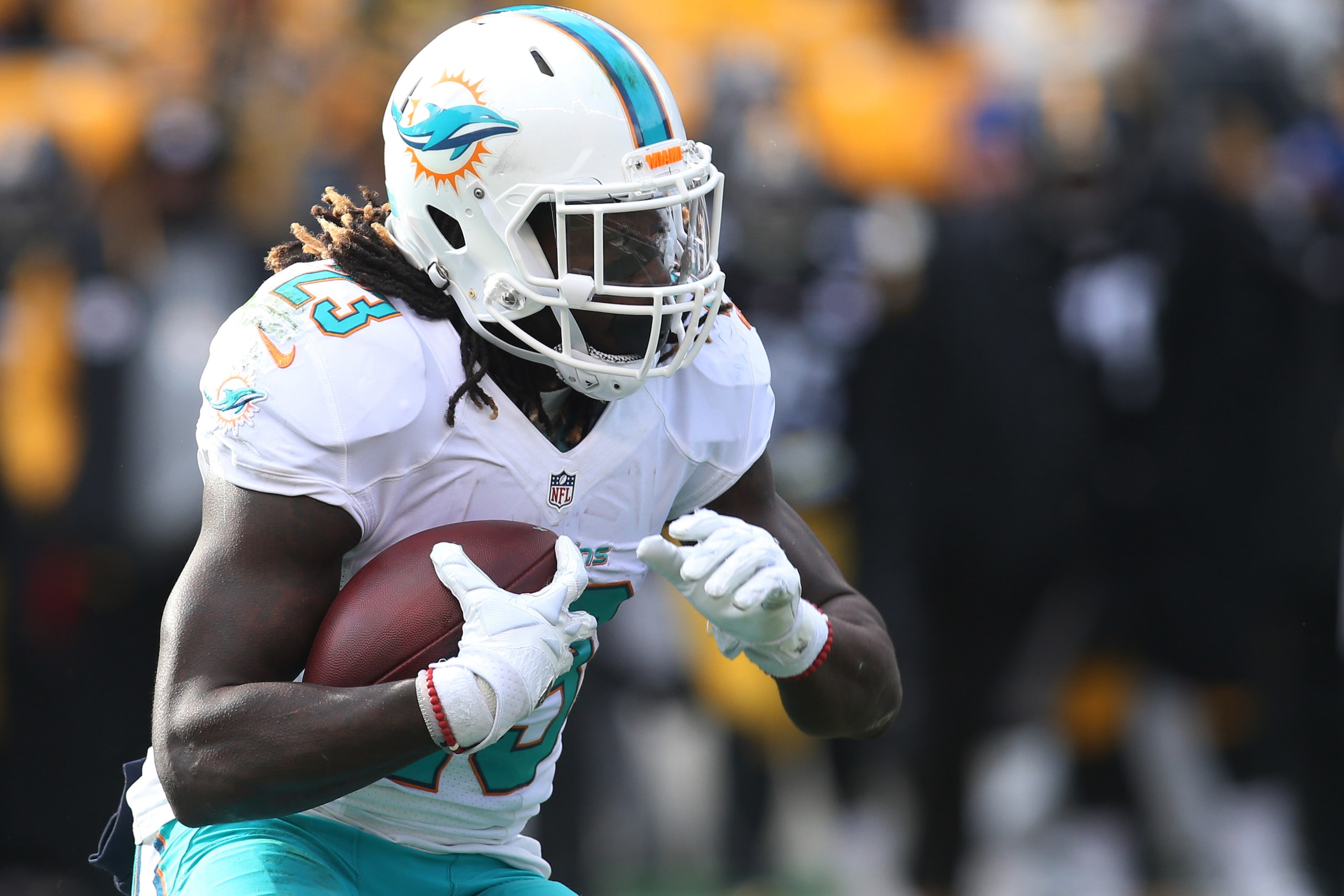 Jan 8, 2017; Pittsburgh, PA, USA; Miami Dolphins running back Jay Ajayi (23) carries the ball against the Pittsburgh Steelers during the second quarter in the AFC Wild Card playoff football game at Heinz Field. The Steelers won 30-12. Mandatory Credit: Ch Jan 8, 2017; Pittsburgh, PA, USA; Miami Dolphins running back Jay Ajayi (23) carries the ball against the Pittsburgh Steelers during the second quarter in the AFC Wild Card playoff football game at Heinz Field. The Steelers won 30-12. Mandatory Credit: Ch