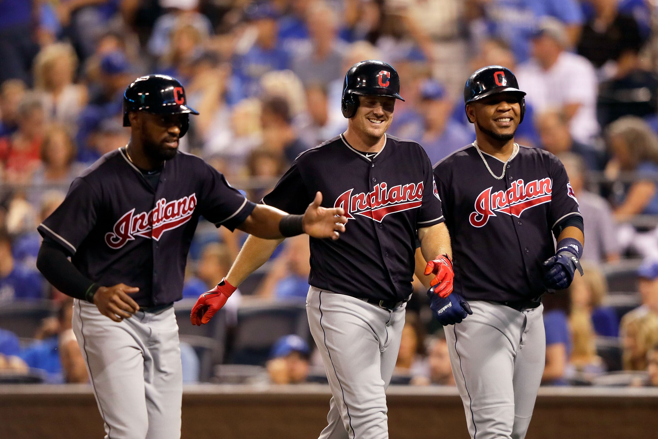 KANSAS CITY, MO - AUGUST 18:  Jay Bruce #32 of the Cleveland Indians is congratulated by Austin Jackson #26 and Edwin Encarnacion #10 after hitting a 3-run home run during the 7th inning of the game against the Kansas City Royals at Kauffman Stadium on Au