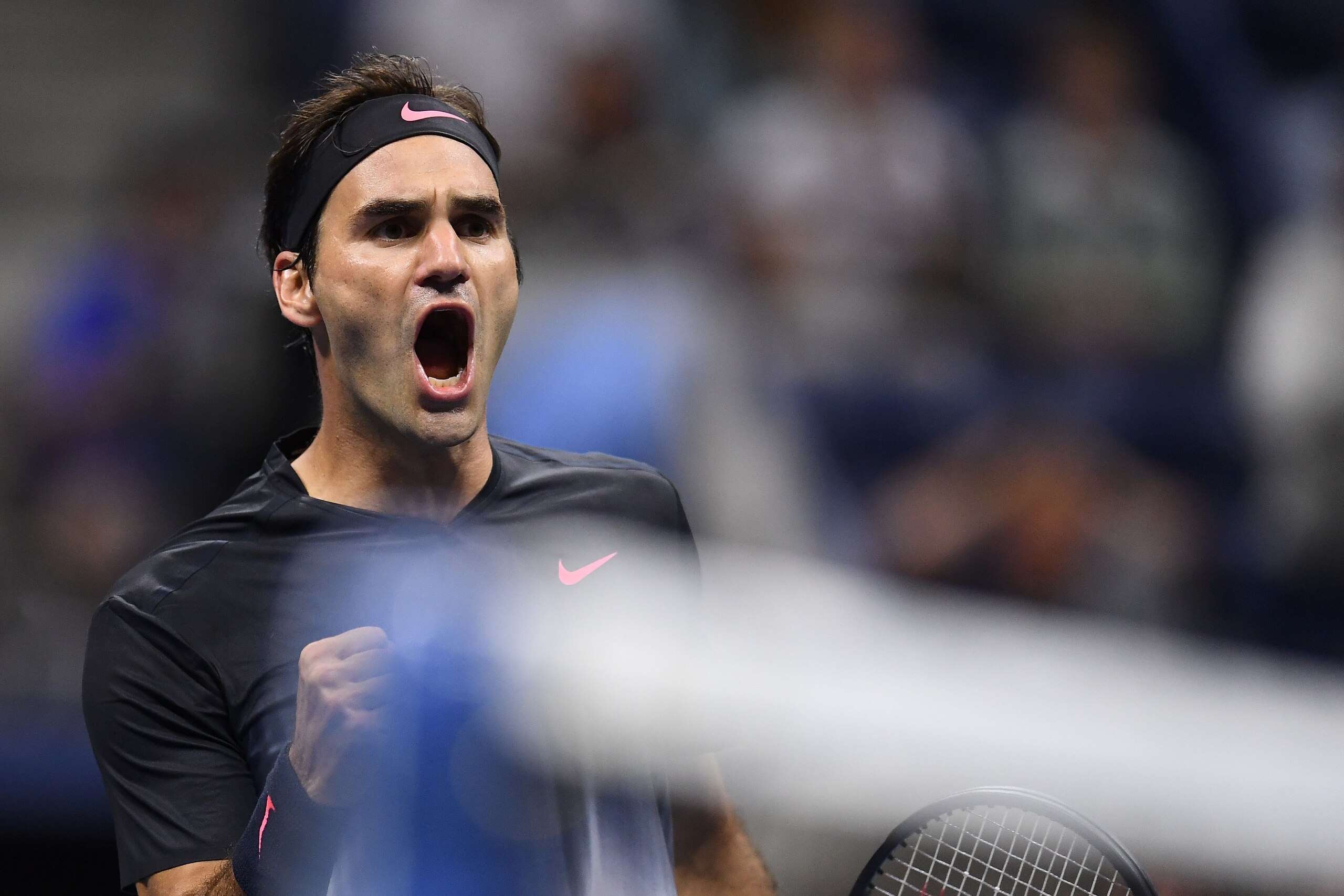 Switzerland's Roger Federer wins a point against Frances Tiafoe of the US during their 2017 US Open Men's Singles match at the USTA Billie Jean King National Tennis Center in New York on August 29, 2017. / AFP PHOTO / Jewel SAMAD        (Photo credit shou