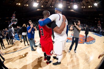 NEW YORK, NY - JANUARY 12: Carmelo Anthony #7 of the New York Knicks shares a hug with Dwyane Wade #3 of the Chicago Bulls after the game on January 12, 2017 at Madison Square Garden in New York City, New York.  NOTE TO USER: User expressly acknowledges a