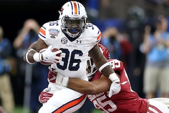NEW ORLEANS, LA - JANUARY 02:  Kamryn Pettway #36 of the Auburn Tigers is tackled by Austin Roberts #95 of the Oklahoma Sooners during the Allstate Sugar Bowl at the Mercedes-Benz Superdome on January 2, 2017 in New Orleans, Louisiana.  (Photo by Matthew 