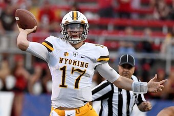 LAS VEGAS, NV - NOVEMBER 12:  Quarterback Josh Allen #17 of the Wyoming Cowboys throws against the UNLV Rebels during their game at Sam Boyd Stadium on November 12, 2016 in Las Vegas, Nevada. UNLV won 69-66 in triple overtime.  (Photo by Ethan Miller/Gett