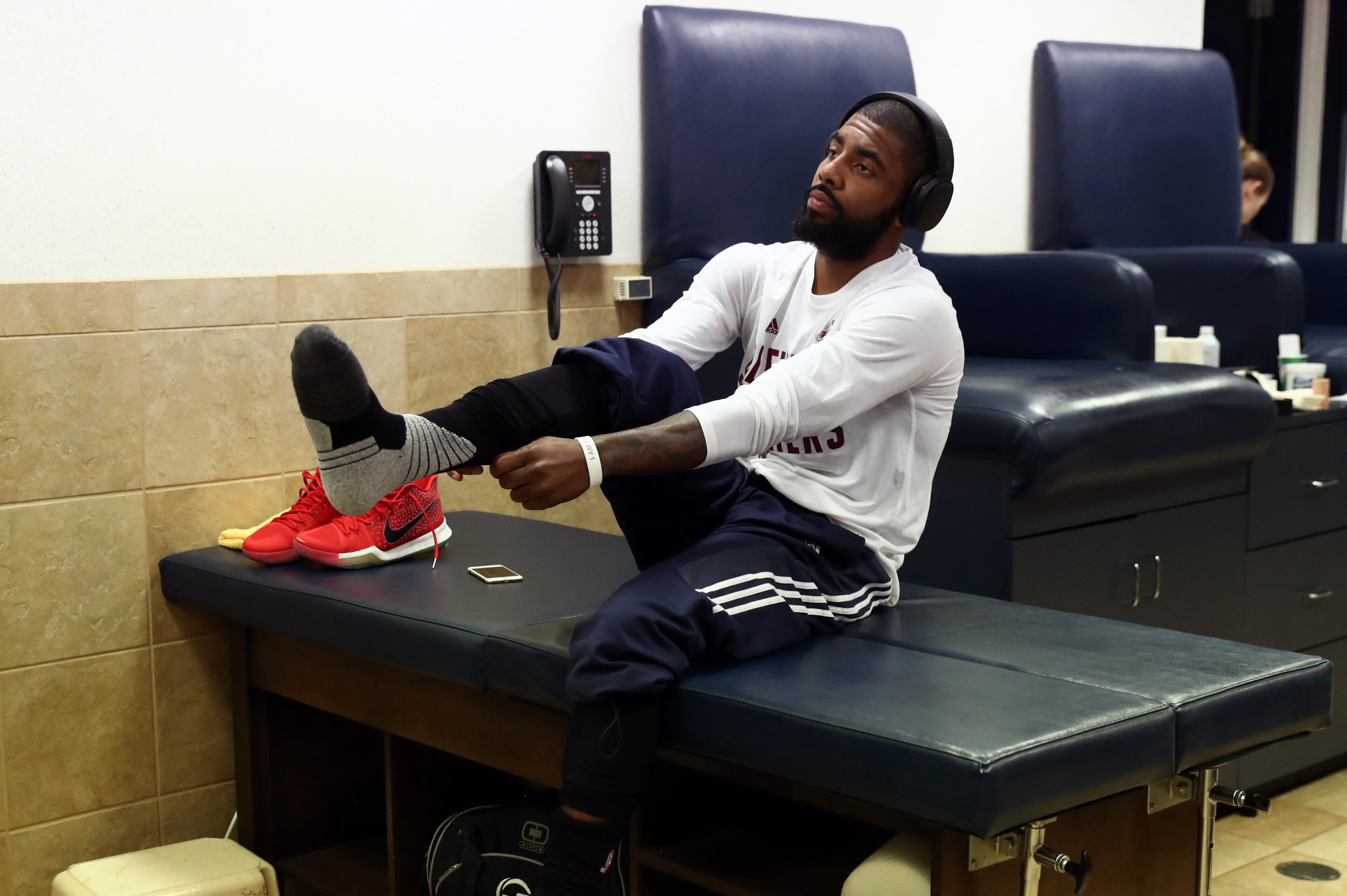 CLEVELAND, OH - JUNE 7: Kyrie Irving #2 of the Cleveland Cavaliers puts his socks on before the game against the Golden State Warriors in Game Three of the 2017 NBA Finals on June 7, 2017 at Quicken Loans Arena in Cleveland, Ohio. NOTE TO USER: User expr CLEVELAND, OH - JUNE 7: Kyrie Irving #2 of the Cleveland Cavaliers puts his socks on before the game against the Golden State Warriors in Game Three of the 2017 NBA Finals on June 7, 2017 at Quicken Loans Arena in Cleveland, Ohio. NOTE TO USER: User expr