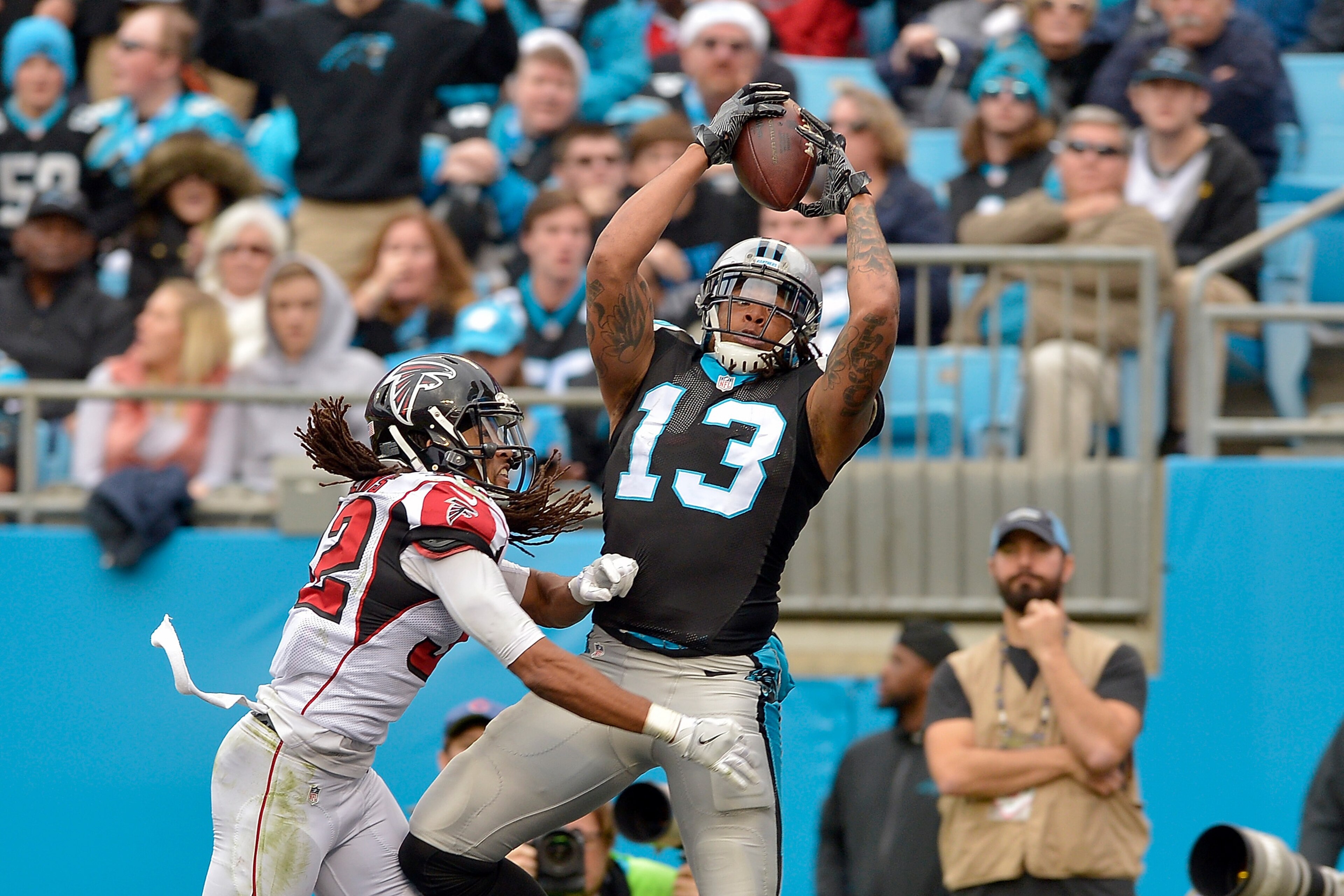 CHARLOTTE, NC - DECEMBER 24:  Kelvin Benjamin #13 of the Carolina Panthers catches a touchdown pass against Jalen Collins #32 of the Atlanta Falcons in the 3rd quarter during the game at Bank of America Stadium on December 24, 2016 in Charlotte, North Car