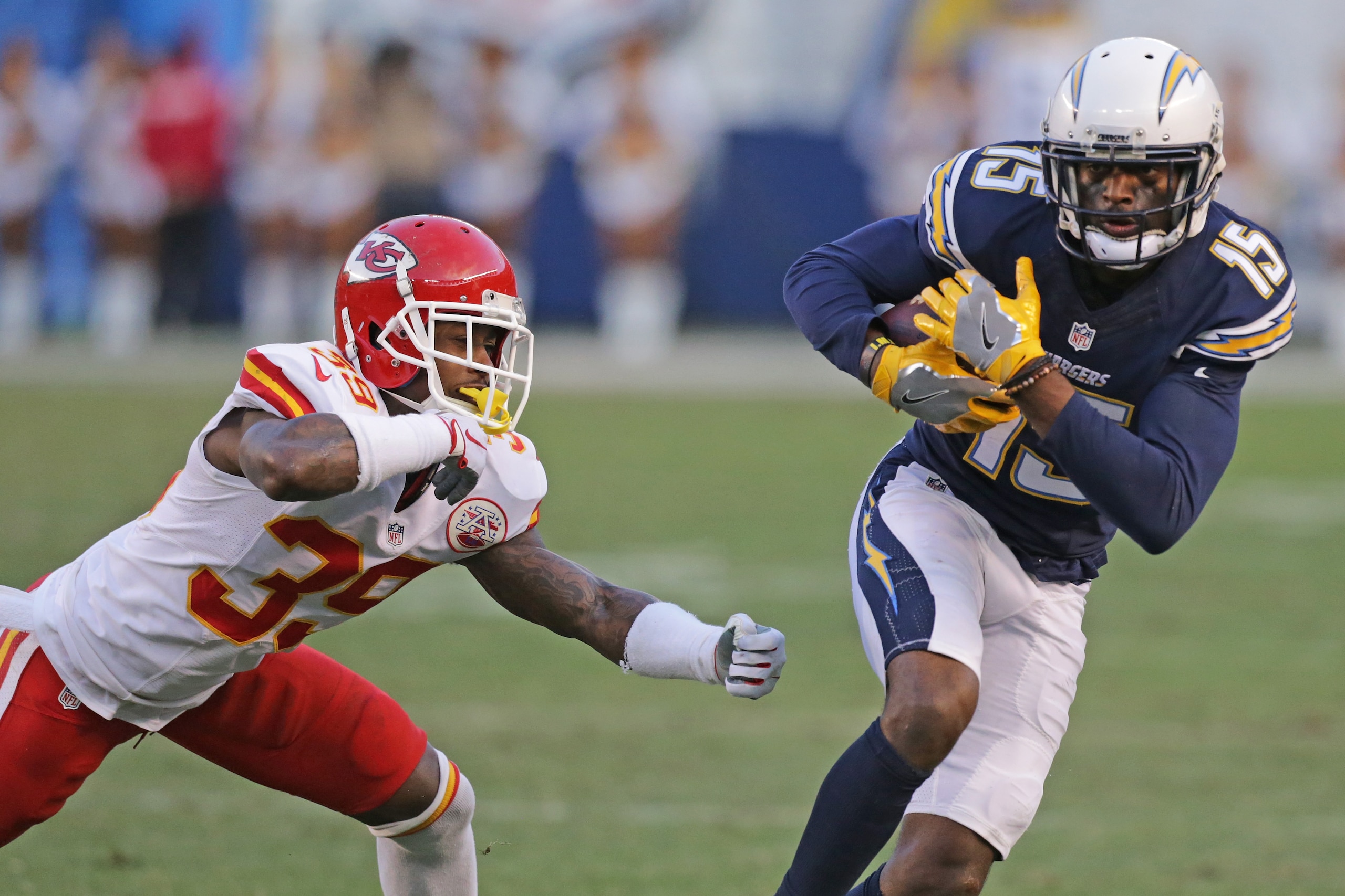 SAN DIEGO, CA - JANUARY 01: Dontrelle Inman #15 of the San Diego Chargers carries the ball against Terrance Mitchell #39 the Kansas City Chiefs during a NFL game at Qualcomm Stadium on January 1, 2017 in San Diego, California.  (Photo by Leon Bennett/Gett