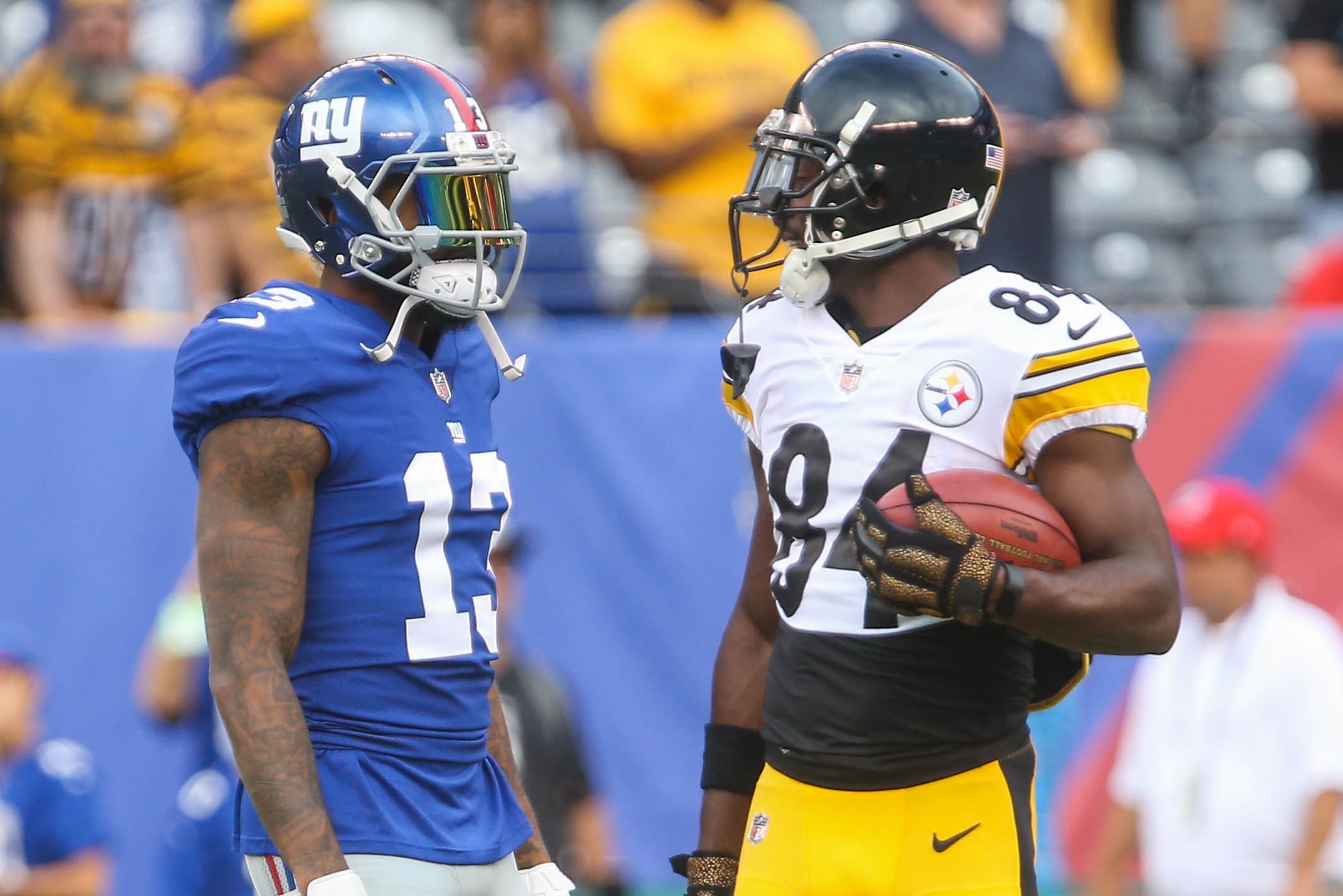 Aug 11, 2017; East Rutherford, NJ, USA; New York Giants wide receiver Odell Beckham Jr. (13) and Pittsburgh Steelers wide receiver Antonio Brown (84) talk during the pregame warmups for their game at MetLife Stadium. Mandatory Credit: Ed Mulholland-USA TO