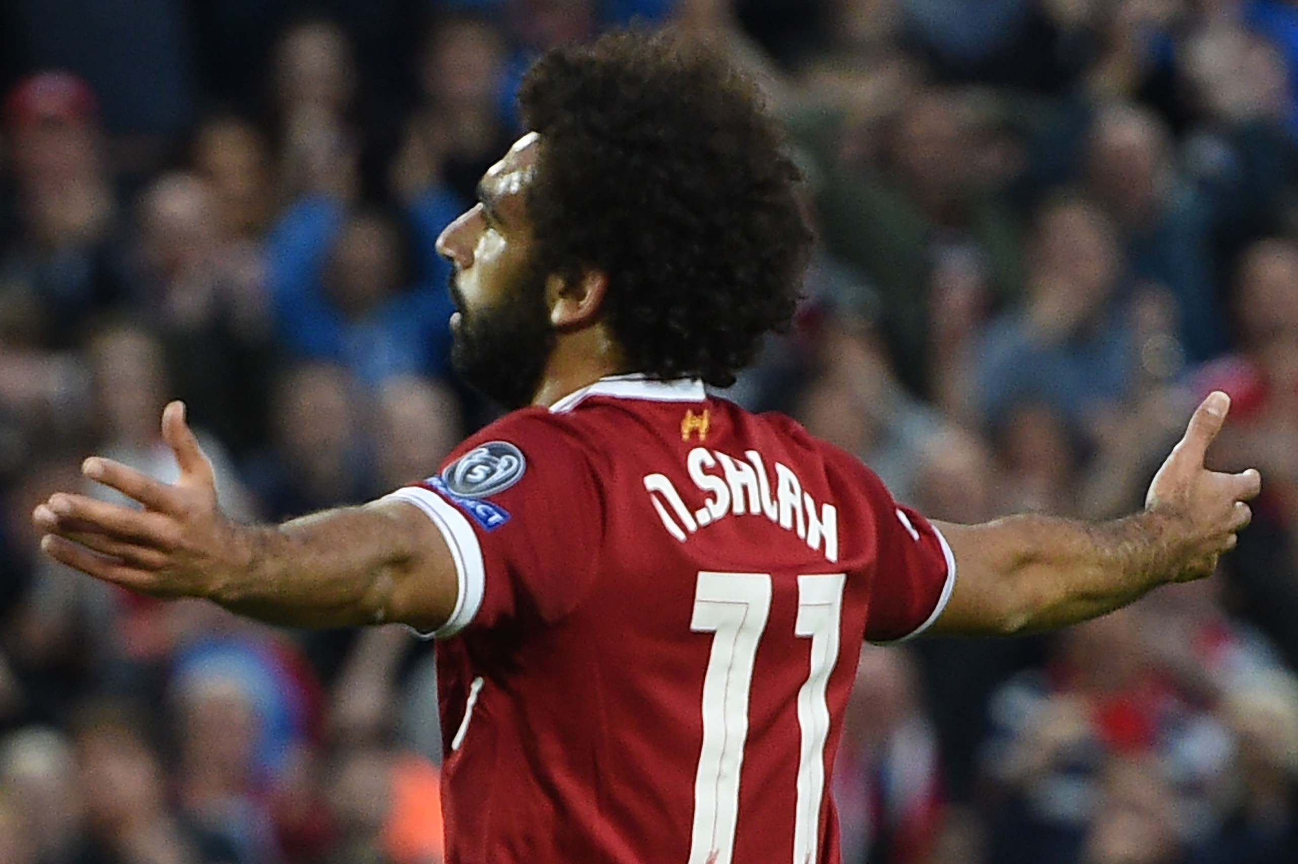 Liverpool's Egyptian midfielder Mohamed Salah celebrates scoring his team's second goal during the Champions League qualifier, second leg match between Liverpool and Hoffenheim at Anfield stadium in Liverpool on August 23, 2017. / AFP PHOTO / Oli SCARFF Liverpool's Egyptian midfielder Mohamed Salah celebrates scoring his team's second goal during the Champions League qualifier, second leg match between Liverpool and Hoffenheim at Anfield stadium in Liverpool on August 23, 2017. / AFP PHOTO / Oli SCARFF