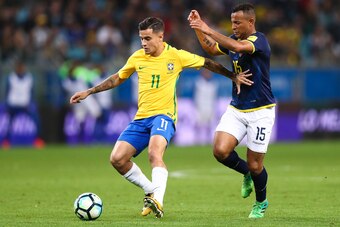 PORTO ALEGRE, BRAZIL - AUGUST 31: Philippe Coutinho (L) of Brazil struggles for the ball with Pedro Quinonez of Ecuador during a match between Brazil and Ecuador as part of 2018 FIFA World Cup Russia Qualifier at Arena do Gremio on August 31, 2017 in Port
