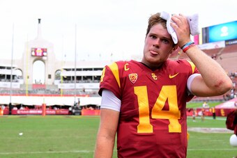 LOS ANGELES, CA - SEPTEMBER 02:  Sam Darnold #14 of the USC Trojans wipes his forehead after a 49-31 Trojan win over the Western Michigan Broncos at Los Angeles Memorial Coliseum on September 2, 2017 in Los Angeles, California.  (Photo by Harry How/Getty 