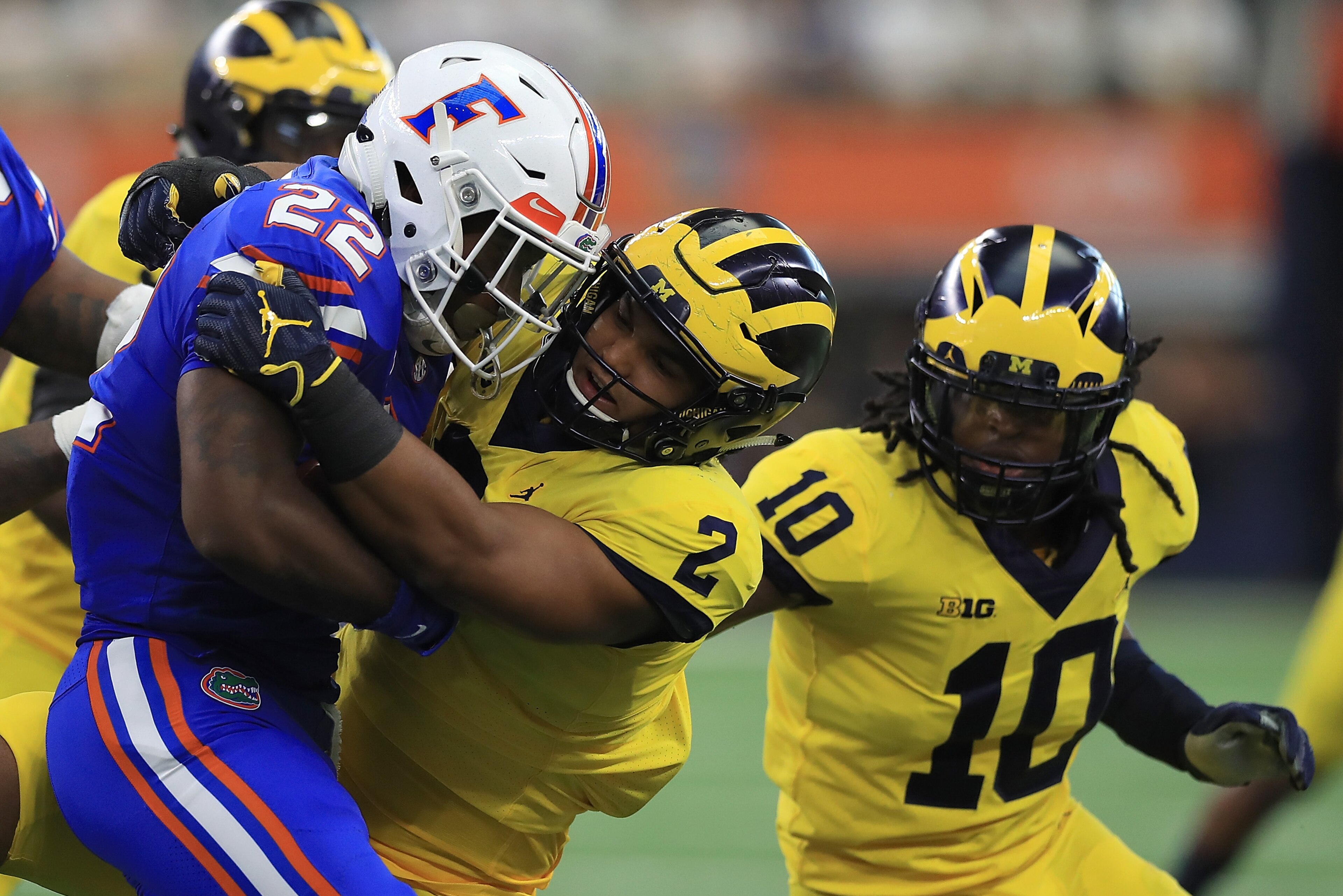 ARLINGTON, TX - SEPTEMBER 02: Lamical Perine #22 of the Florida Gators gets stopped by Carlo Kemp #2 of the Michigan Wolverines in the first half of a game at AT&T Stadium on September 2, 2017 in Arlington, Texas. (Photo by Ronald Martinez/Getty Images) ARLINGTON, TX - SEPTEMBER 02: Lamical Perine #22 of the Florida Gators gets stopped by Carlo Kemp #2 of the Michigan Wolverines in the first half of a game at AT&T Stadium on September 2, 2017 in Arlington, Texas. (Photo by Ronald Martinez/Getty Images)