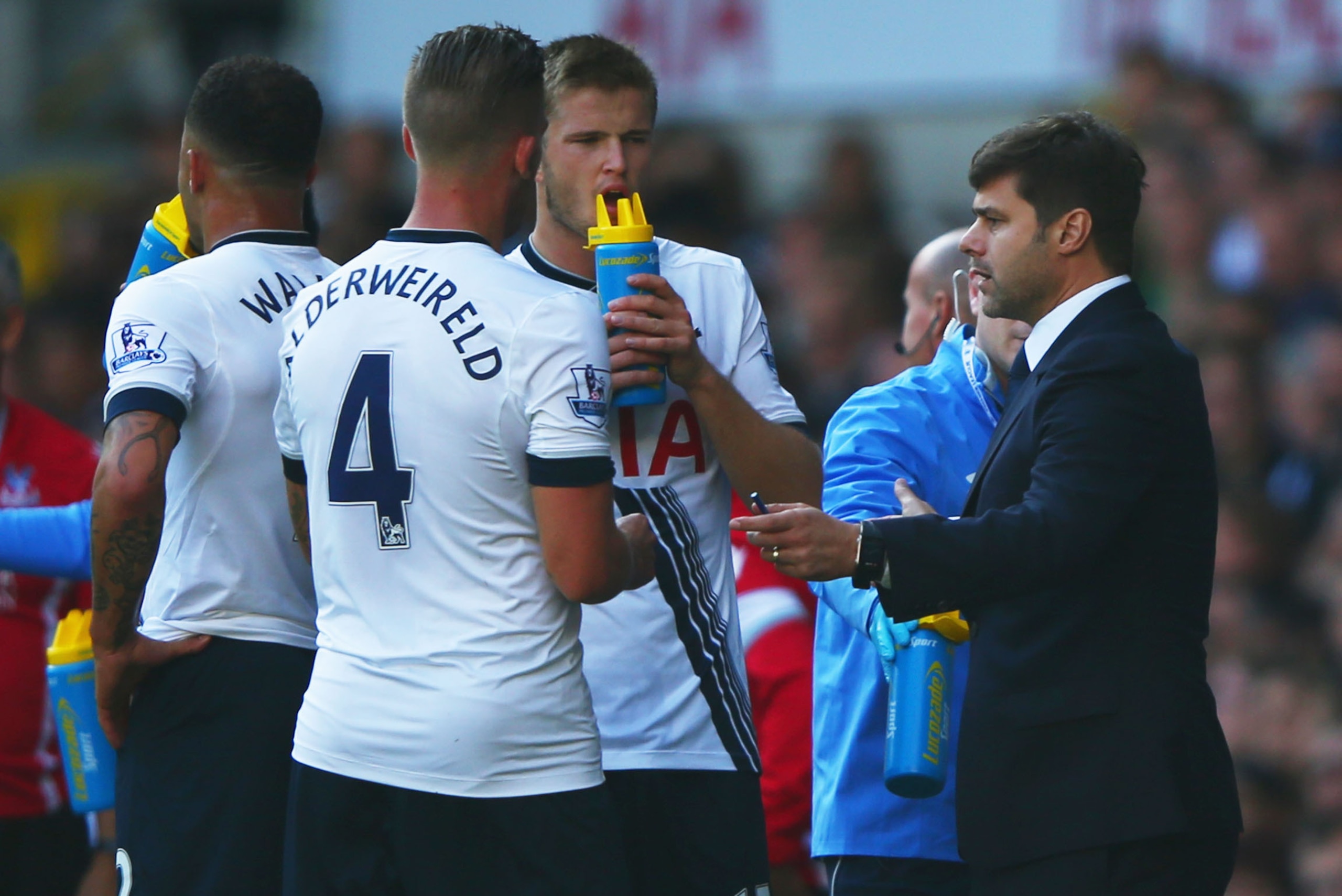 LONDON, ENGLAND - SEPTEMBER 20:  Mauricio Pochettino manager of Tottenham Hotspur (R) speaks to Eric Dier and Toby Alderweireld of Tottenham Hotspur as they take a drink during the Barclays Premier League match between Tottenham Hotspur and Crystal Palace