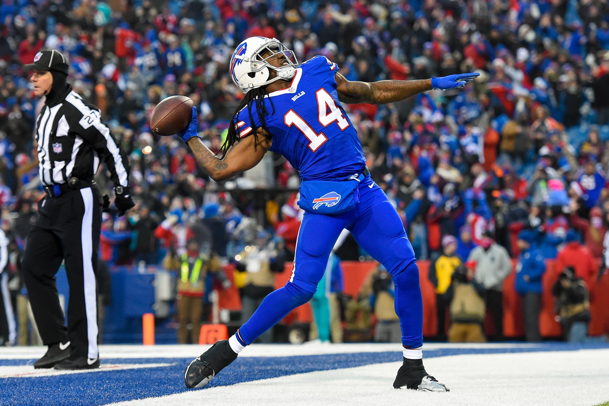 ORCHARD PARK, NY - DECEMBER 24:  Sammy Watkins #14 of the Buffalo Bills celebrates a touchdown reception by teammate Charles Clay (not pictured) by tossing the ball into the stands against the Miami Dolphins during the fourth quarter at New Era Field on D