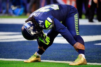 GLENDALE, AZ - FEBRUARY 01:  Marshawn Lynch #24 of the Seattle Seahawks stretches prior to Super Bowl XLIX against the New England Patriots at University of Phoenix Stadium on February 1, 2015 in Glendale, Arizona.  (Photo by Rob Carr/Getty Images)