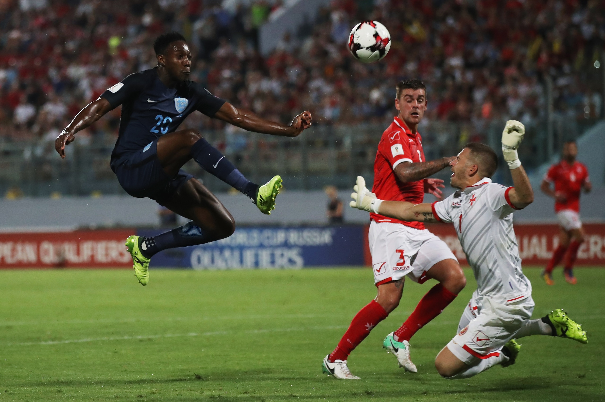 VALLETTA, MALTA - SEPTEMBER 01: Danny Welbeck of England beats goalkeeper Andrew Hogg of Malta as he scores their third goal during the FIFA 2018 World Cup Qualifier between Malta and England at Ta'Qali National Stadium on September 1, 2017 in Valletta, VALLETTA, MALTA - SEPTEMBER 01: Danny Welbeck of England beats goalkeeper Andrew Hogg of Malta as he scores their third goal during the FIFA 2018 World Cup Qualifier between Malta and England at Ta'Qali National Stadium on September 1, 2017 in Valletta,