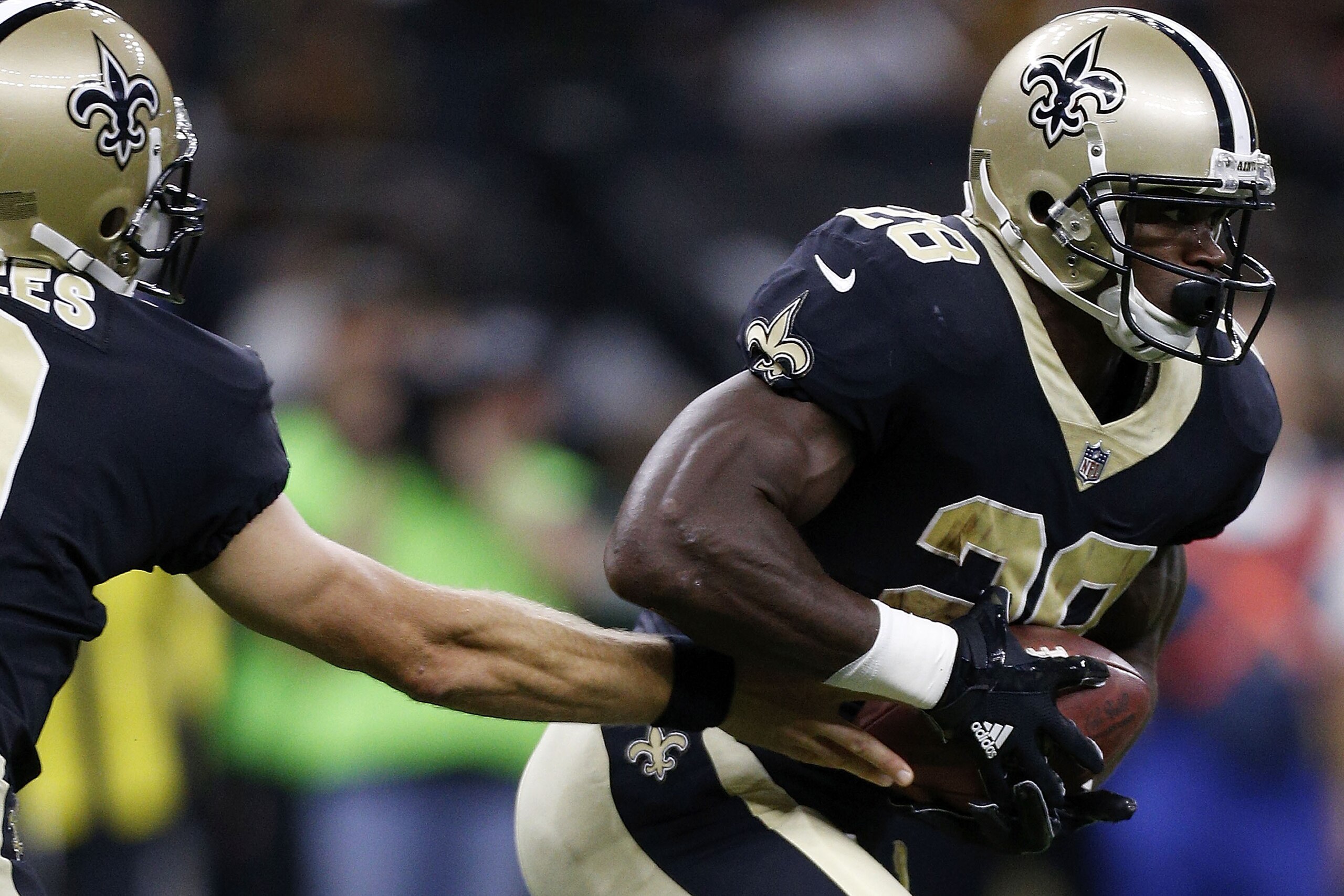 NEW ORLEANS, LA - AUGUST 26: Drew Brees #9 of the New Orleans Saints hands the ball to Adrian Peterson #28 during the first half of a preseason game against the Houston Texans at the Mercedes-Benz Superdome on August 26, 2017 in New Orleans, Louisiana. (P NEW ORLEANS, LA - AUGUST 26: Drew Brees #9 of the New Orleans Saints hands the ball to Adrian Peterson #28 during the first half of a preseason game against the Houston Texans at the Mercedes-Benz Superdome on August 26, 2017 in New Orleans, Louisiana. (P