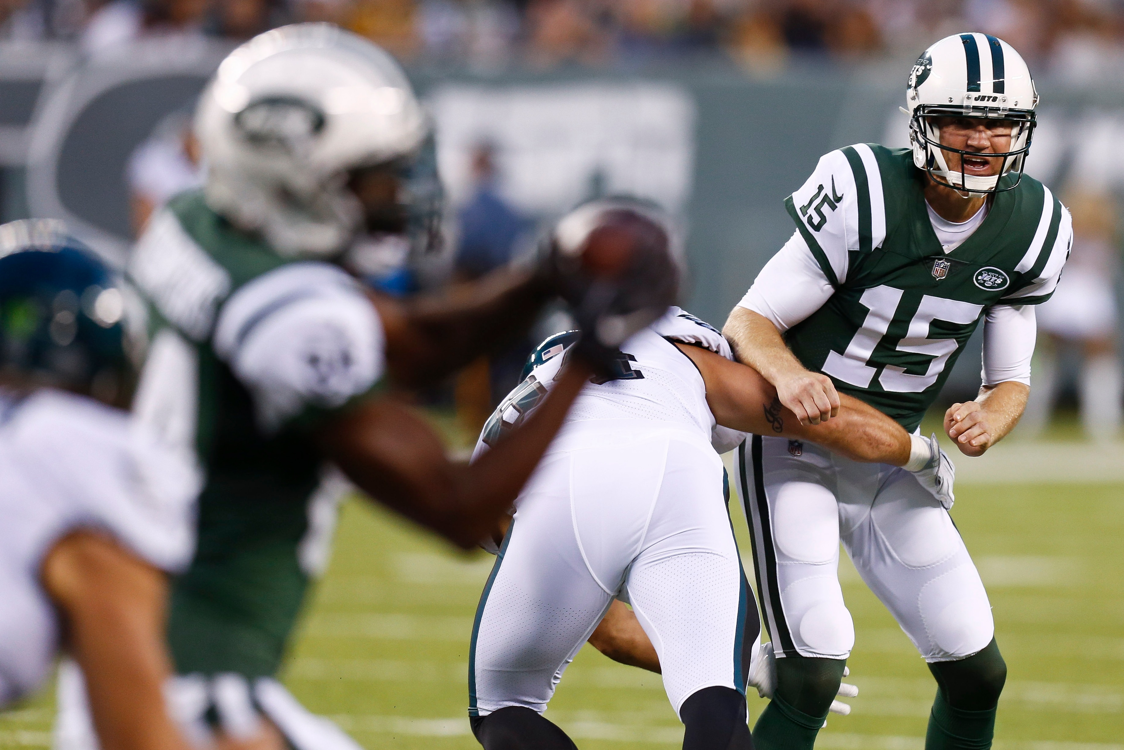 EAST RUTHERFORD, NJ - AUGUST 31: Josh McCown #15 of the New York Jets passes under pressure from Jake Metz #64 of the Philadelphia Eagles during their preseason game at MetLife Stadium on August 31, 2017 in East Rutherford, New Jersey. (Photo by Jeff Zele
