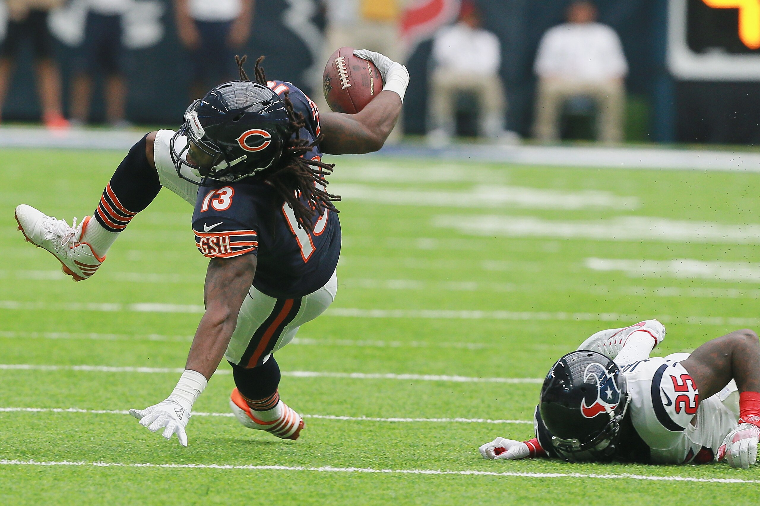 HOUSTON, TX - SEPTEMBER 11: Kevin White #13 of the Chicago Bears breaks the  tackle attempt of Kareem Jackson #25 of the Houston Texans during a NFL football game at NRG Stadium on September 11, 2016 in Houston, Texas.  (Photo by Bob Levey/Getty Images)