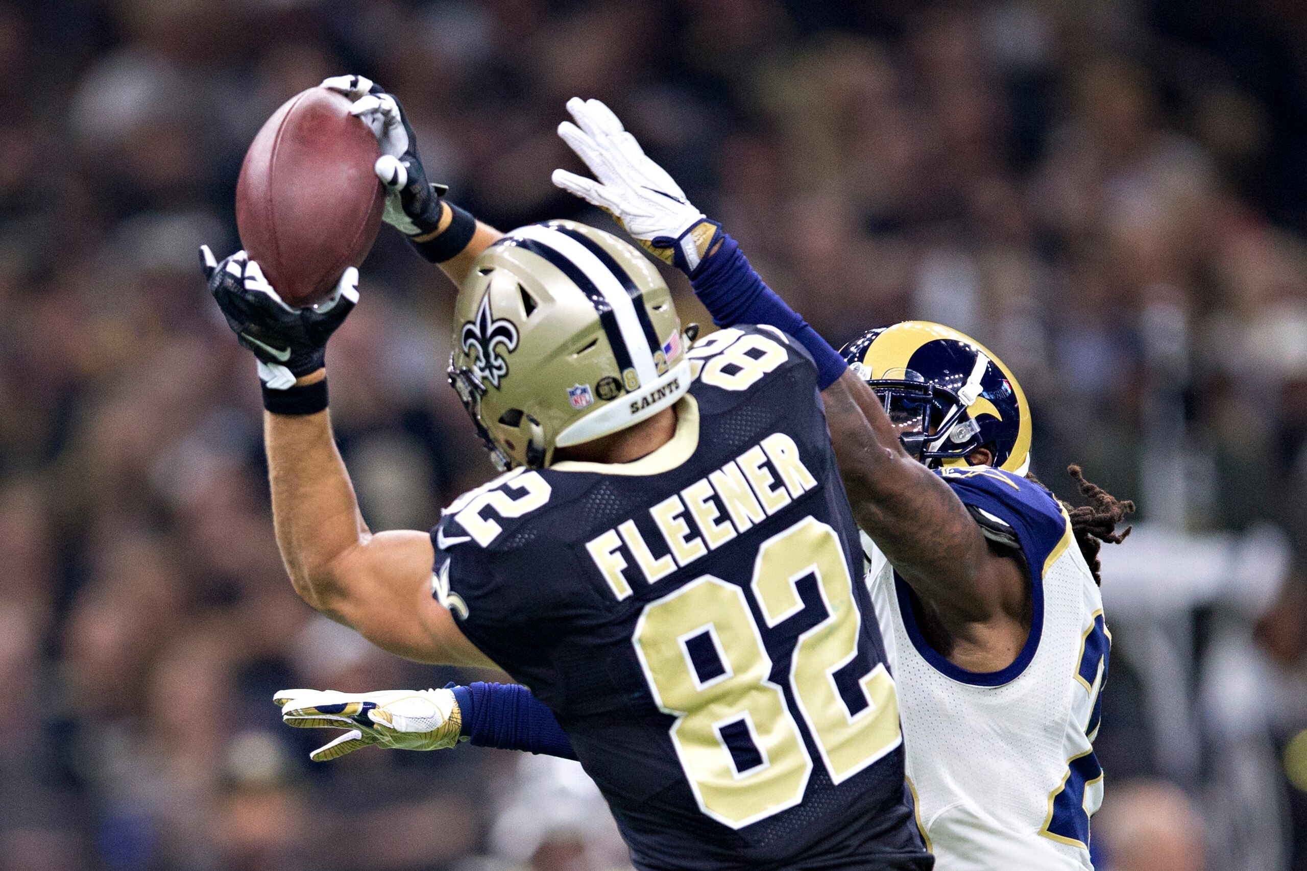 NEW ORLEANS, LA - NOVEMBER 27:  Coby Fleener #82 of the New Orleans Saints catches a pass in the first half over Mark Barron #26 of the Los Angeles Rams at Mercedes-Benz Superdome on November 27, 2016 in New Orleans, Louisiana.  (Photo by Wesley Hitt/Gett