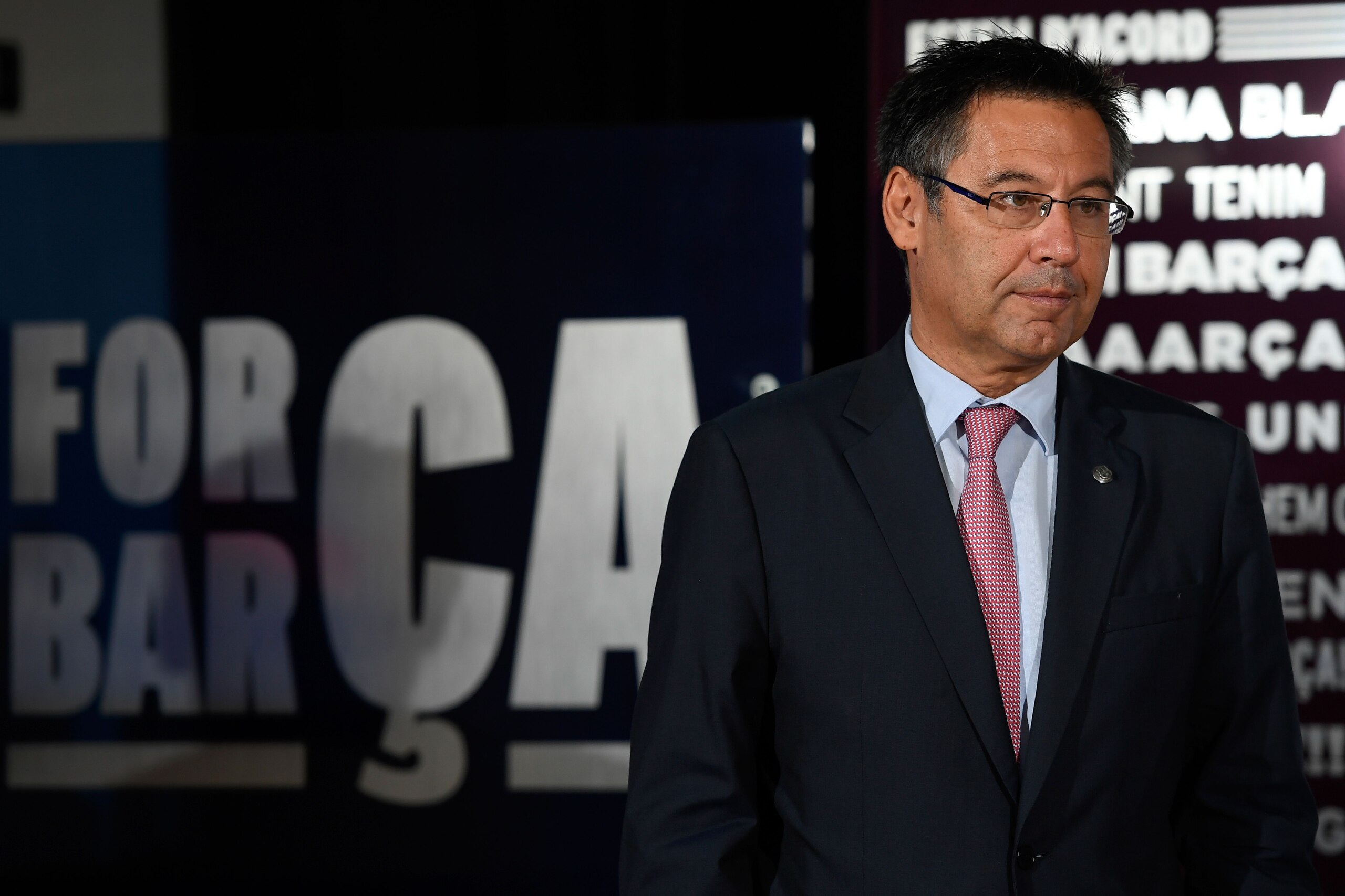 Barcelona's president Josep Maria Bartomeu looks on during the official presentation of Barcelona's new Brazilian football player Paulinho Bezerra, after signing his new contract with the Catalan club at the Camp Nou stadium in Barcelona on August 17, 201