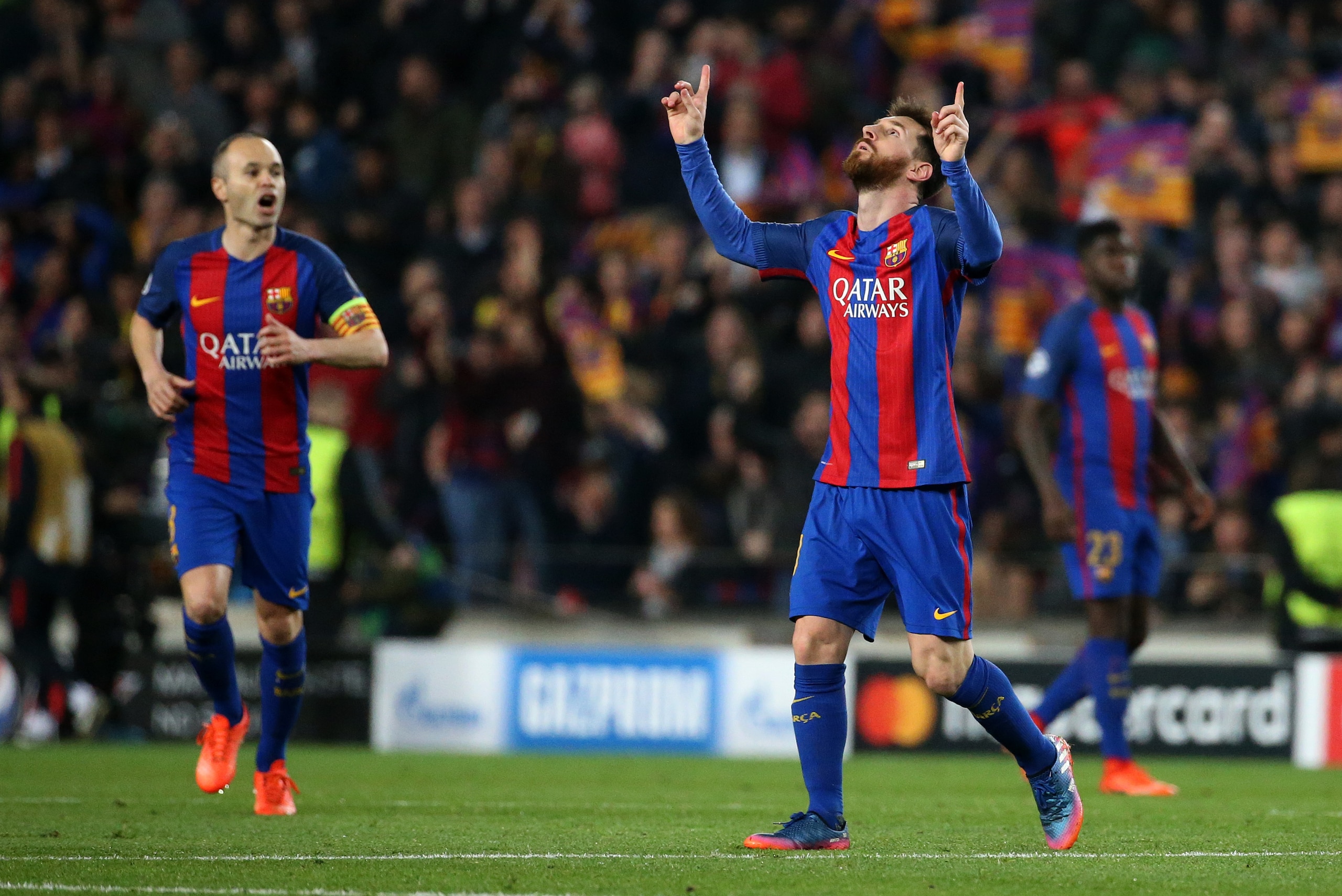 BARCELONA, SPAIN - MARCH 8: Lionel Messi of FC Barcelona celebrates scoring a goal with Andres Iniesta (left) during the UEFA Champions League Round of 16 second leg match between FC Barcelona and Paris Saint-Germain (PSG) at Camp Nou on March 8, 2017 in 
