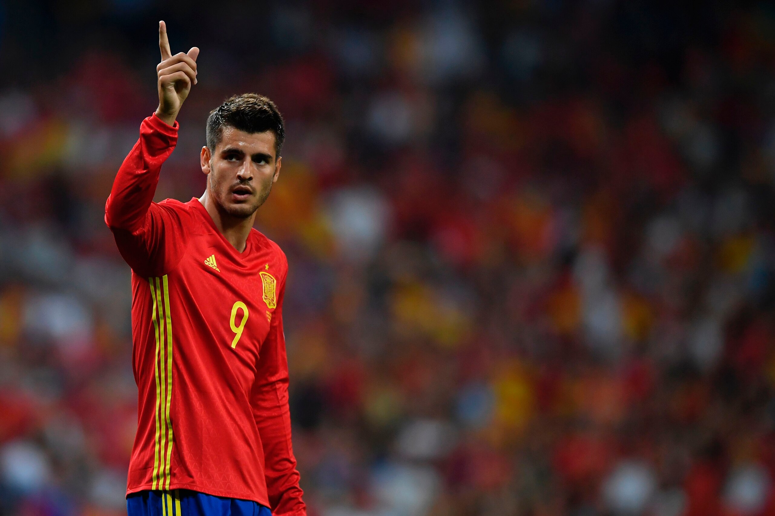 Spain's forward Alvaro Morata celebrates after scoring their third goal during the World Cup 2018 qualifier football match Spain vs Italy at the Santiago Bernabeu stadium in Madrid on September 2, 2017. / AFP PHOTO / GABRIEL BOUYS        (Photo credit sho
