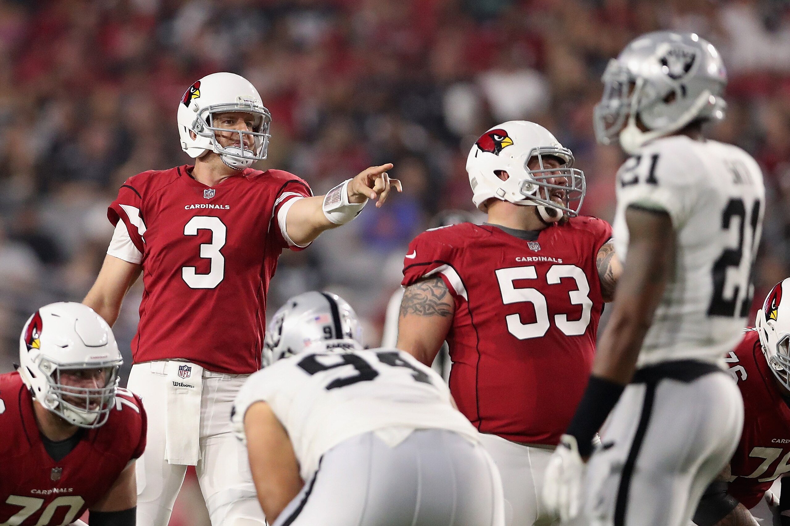 GLENDALE, AZ - AUGUST 12:  Quarterback Carson Palmer #3 of the Arizona Cardinals prepares to snap the football during the NFL game against the Oakland Raiders at the University of Phoenix Stadium on August 12, 2017 in Glendale, Arizona.  The Cardinals def