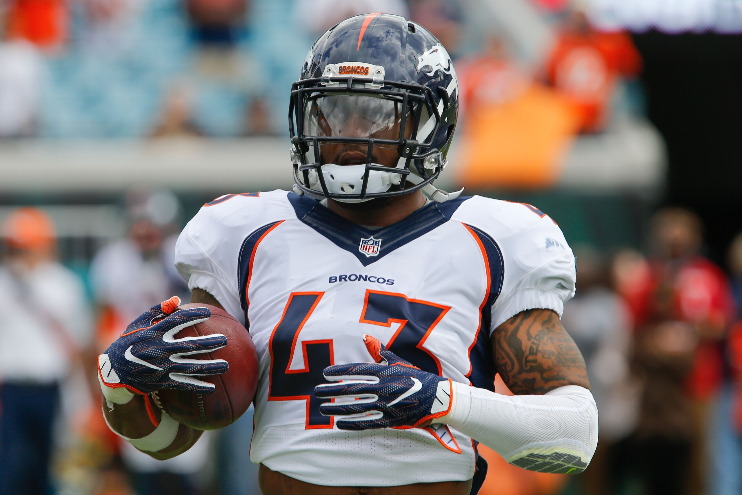 Dec 4, 2016; Jacksonville, FL, USA;  Denver Broncos strong safety T.J. Ward (43) runs with the ball during pre game warmups before an NFL football game against the Jacksonville Jaguars at EverBank Field. Mandatory Credit: Reinhold Matay-USA TODAY Sports