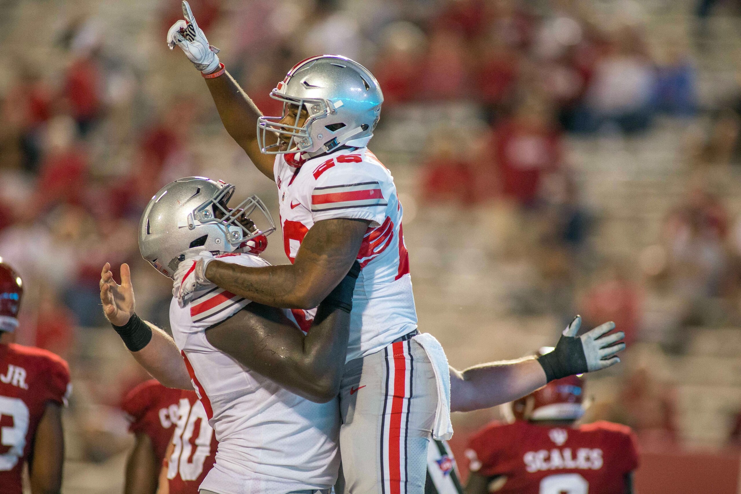 Aug 31, 2017; Bloomington, IN, USA; Ohio State Buckeyes running back Antonio Williams (26) celebrates his touchdown with teammates in the second half of the game against the Indiana Hoosiers at Memorial Stadium. Mandatory Credit: Trevor Ruszkowski-USA TOD