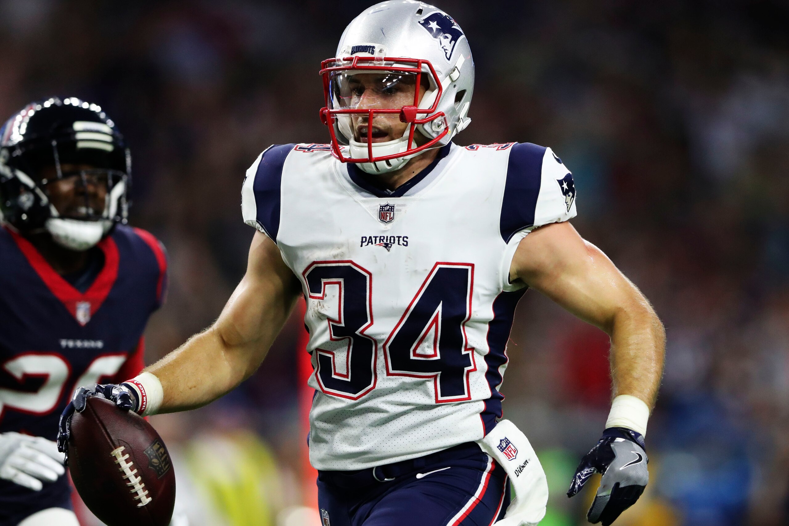 Aug 19, 2017; Houston, TX, USA; New England Patriots running back Rex Burkhead (34) runs for a touchdown against the Houston Texans during the first half at NRG Stadium. Mandatory Credit: Kevin Jairaj-USA TODAY Sports